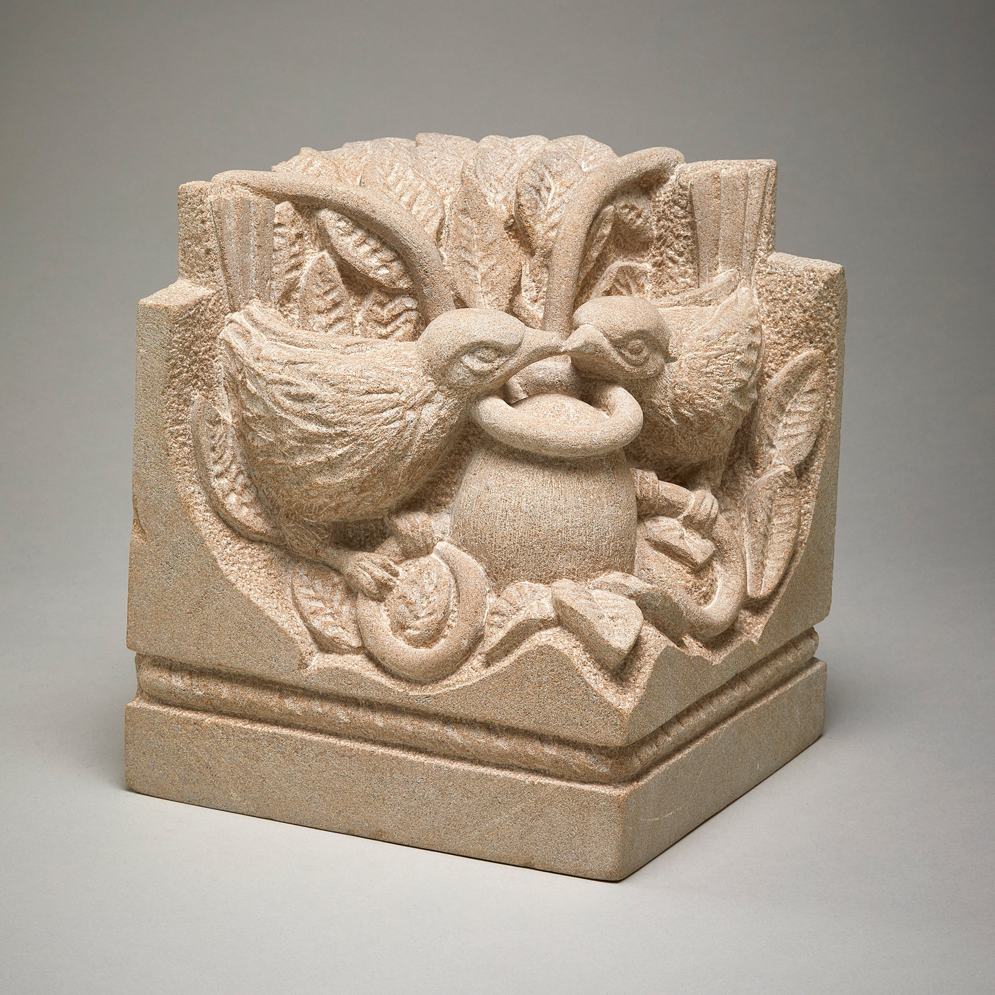 limestone sculpture of two birds