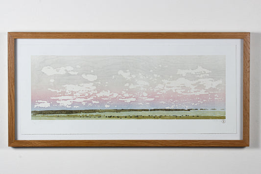 Framed wood print of a Saskatchewan landscape with a sky and cows grazing in a field.