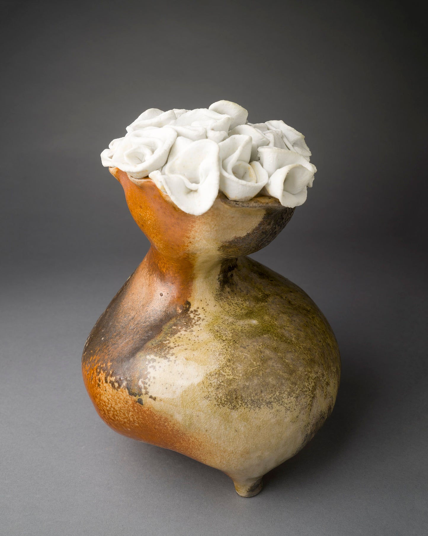 Abstract vase with clay white roses