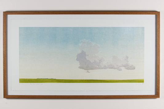 Framed wood print of a Saskatchewan landscape with a large cloud and grassy field.