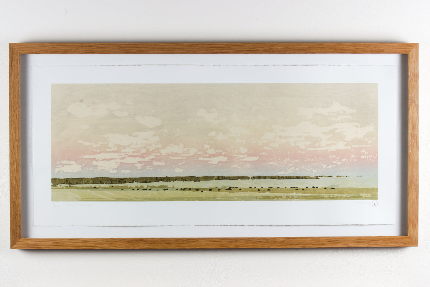 Framed wood print landscape of a soft pink sky and a field of grazing bison.