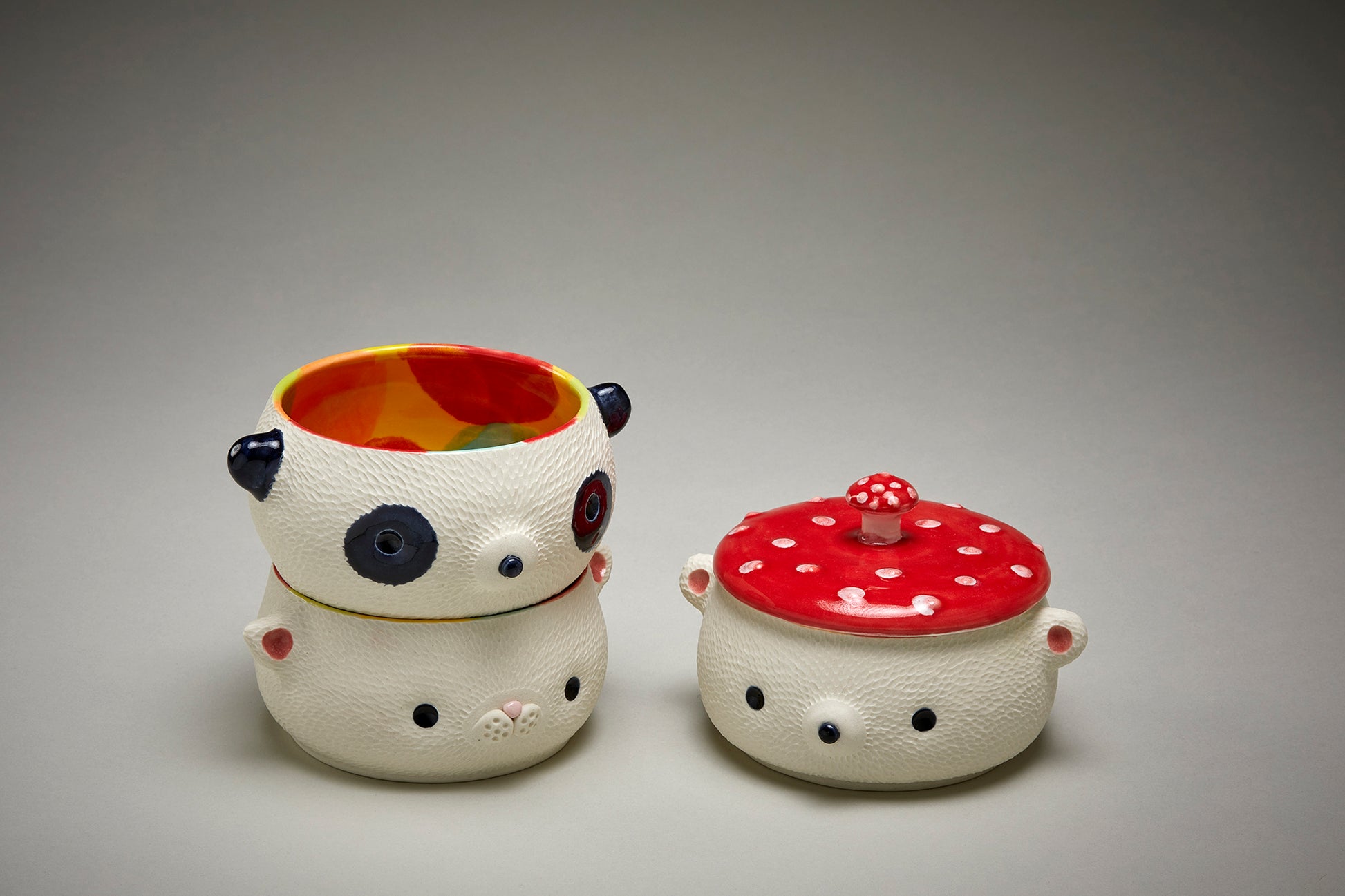 Three candy jars of a cat, panda and bear with a mushroom lid