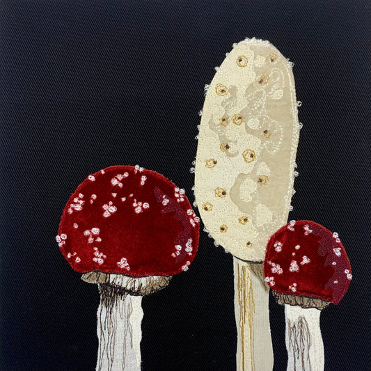 Red and white mushroom fabric collage