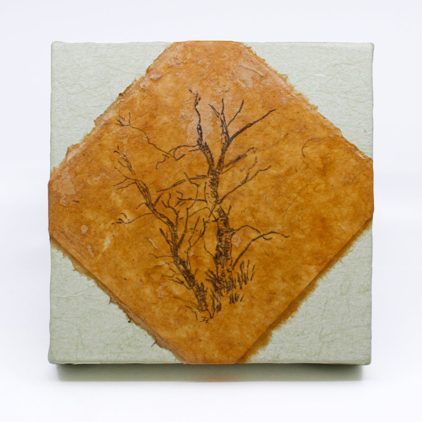 print of a tree on mandmade paper