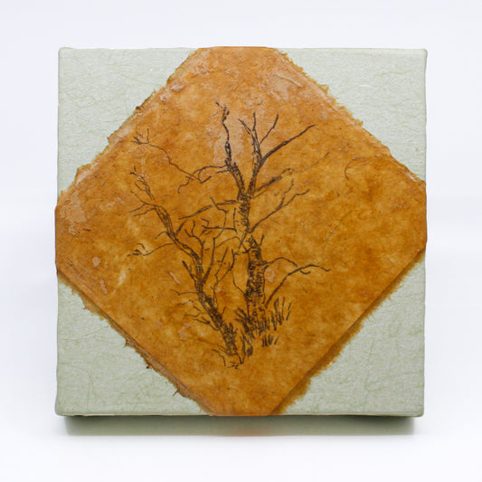 print of a tree on mandmade paper