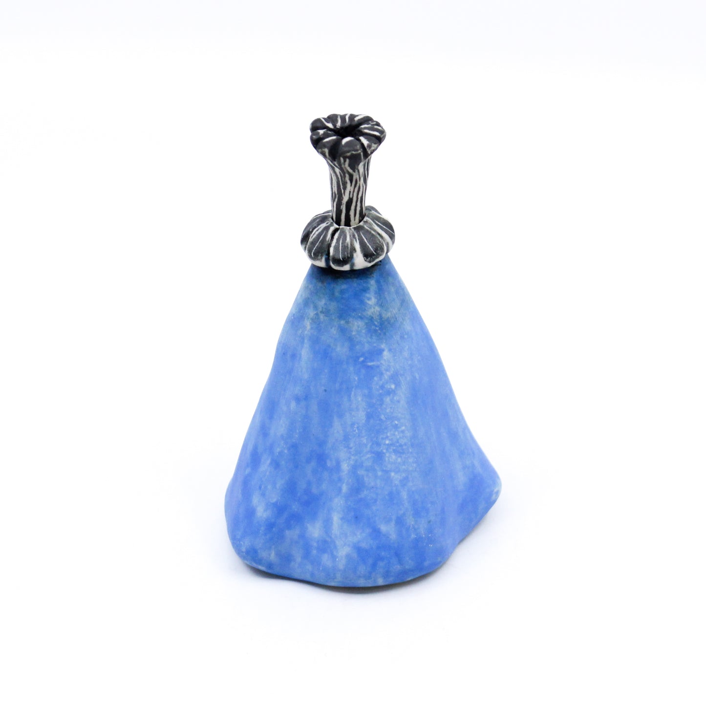 Blue bottle with black and white stopper