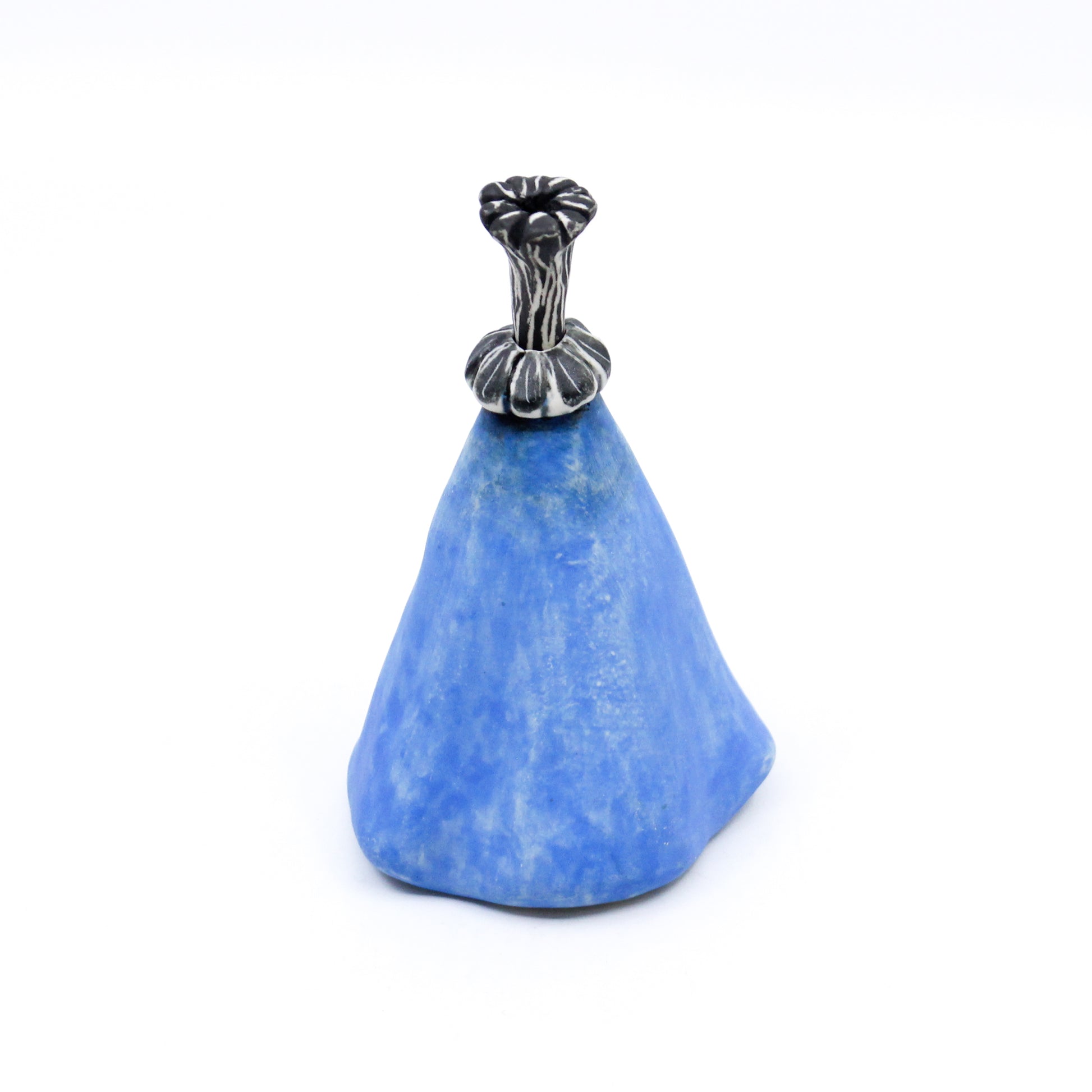 Blue bottle with black and white stopper