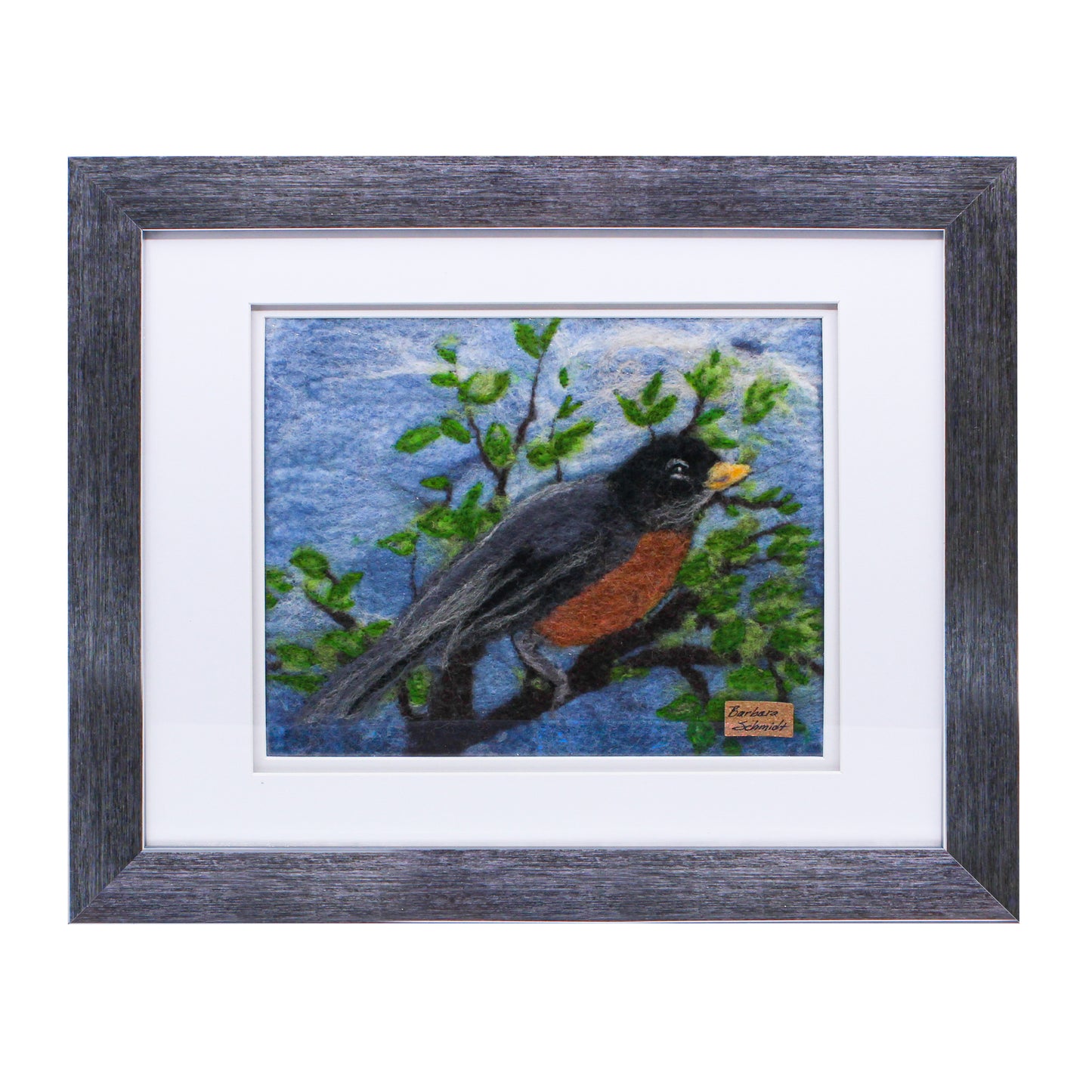 Felted picture of a robin on blue sky