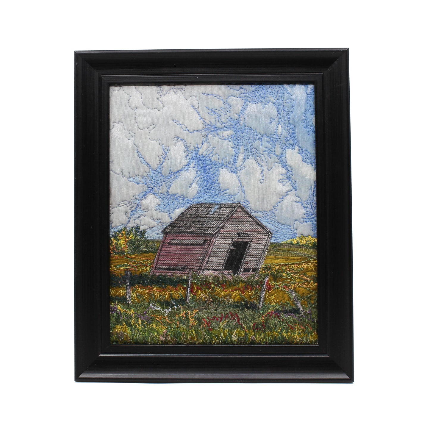 Embroidered scene of a decrepit shed