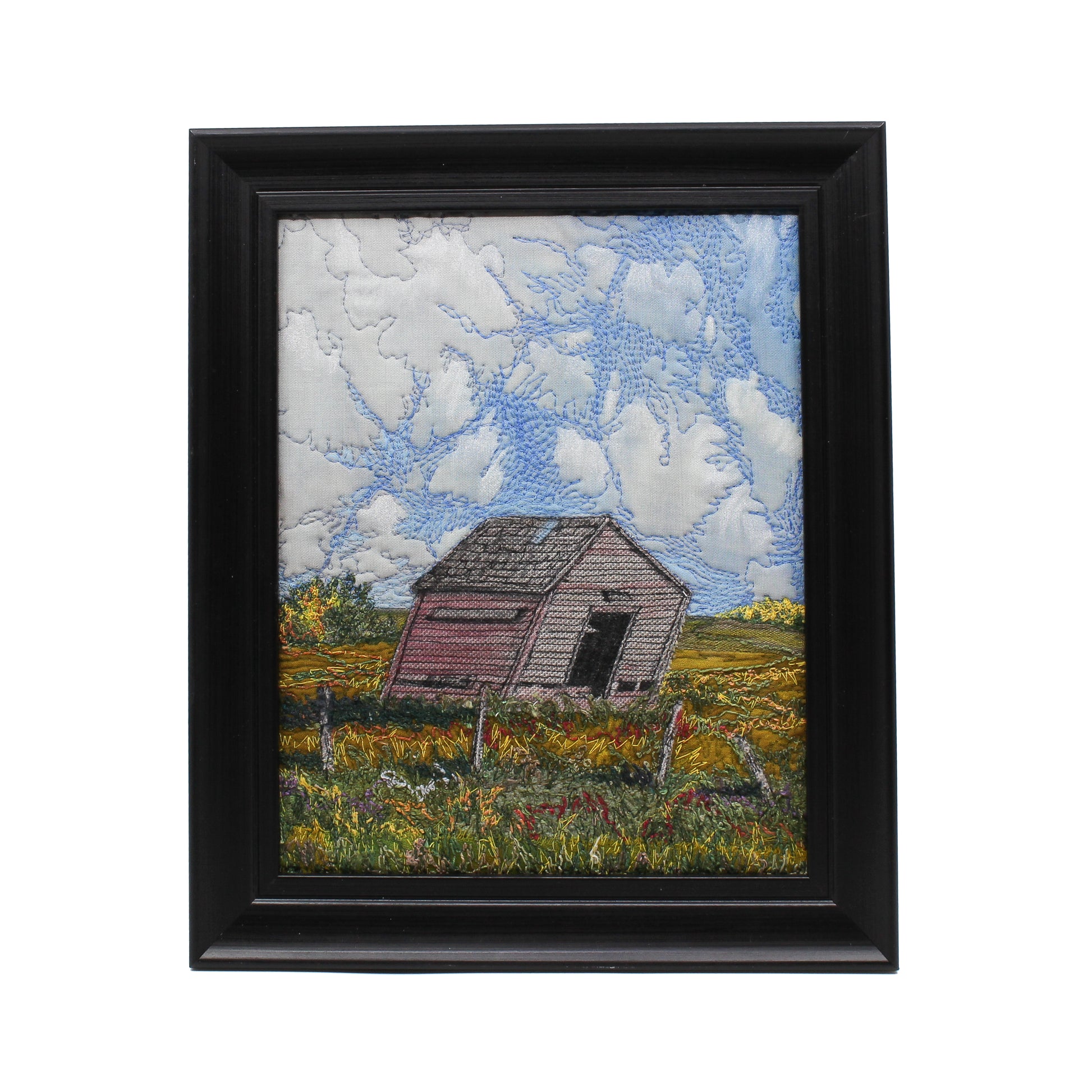 Embroidered scene of a decrepit shed