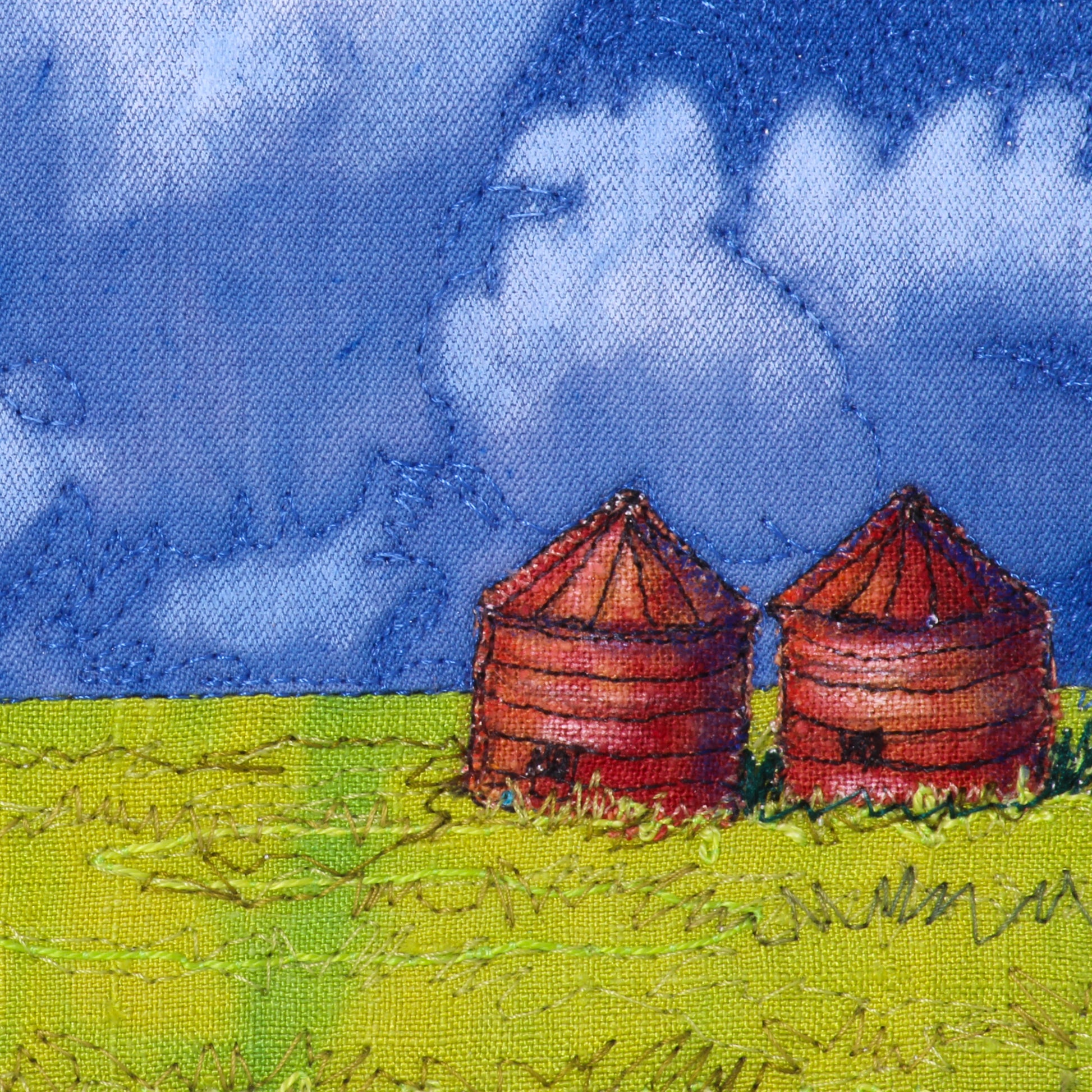 prairie thread painting of field and granaries