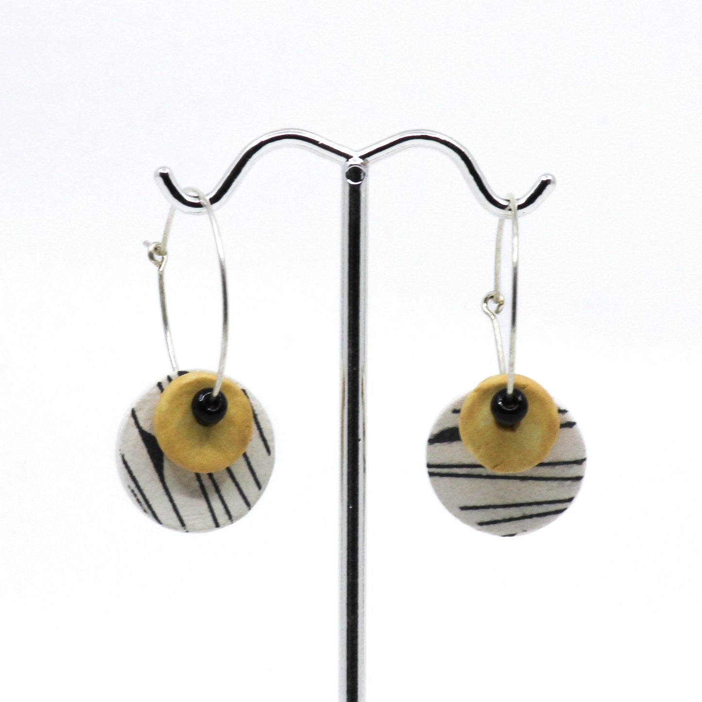 Black white and yellow circle earrings