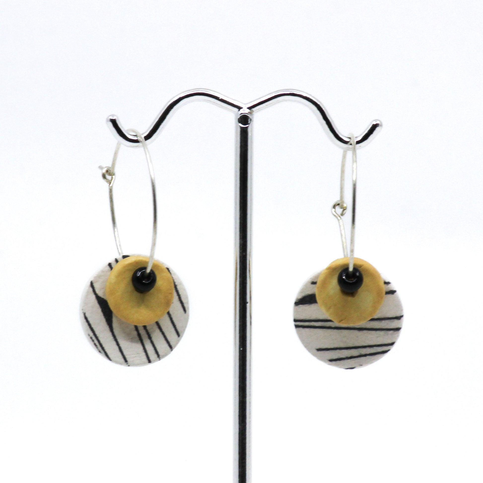 Black white and yellow circle earrings