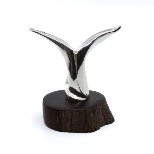 Silver modern miniature statue on wood stand