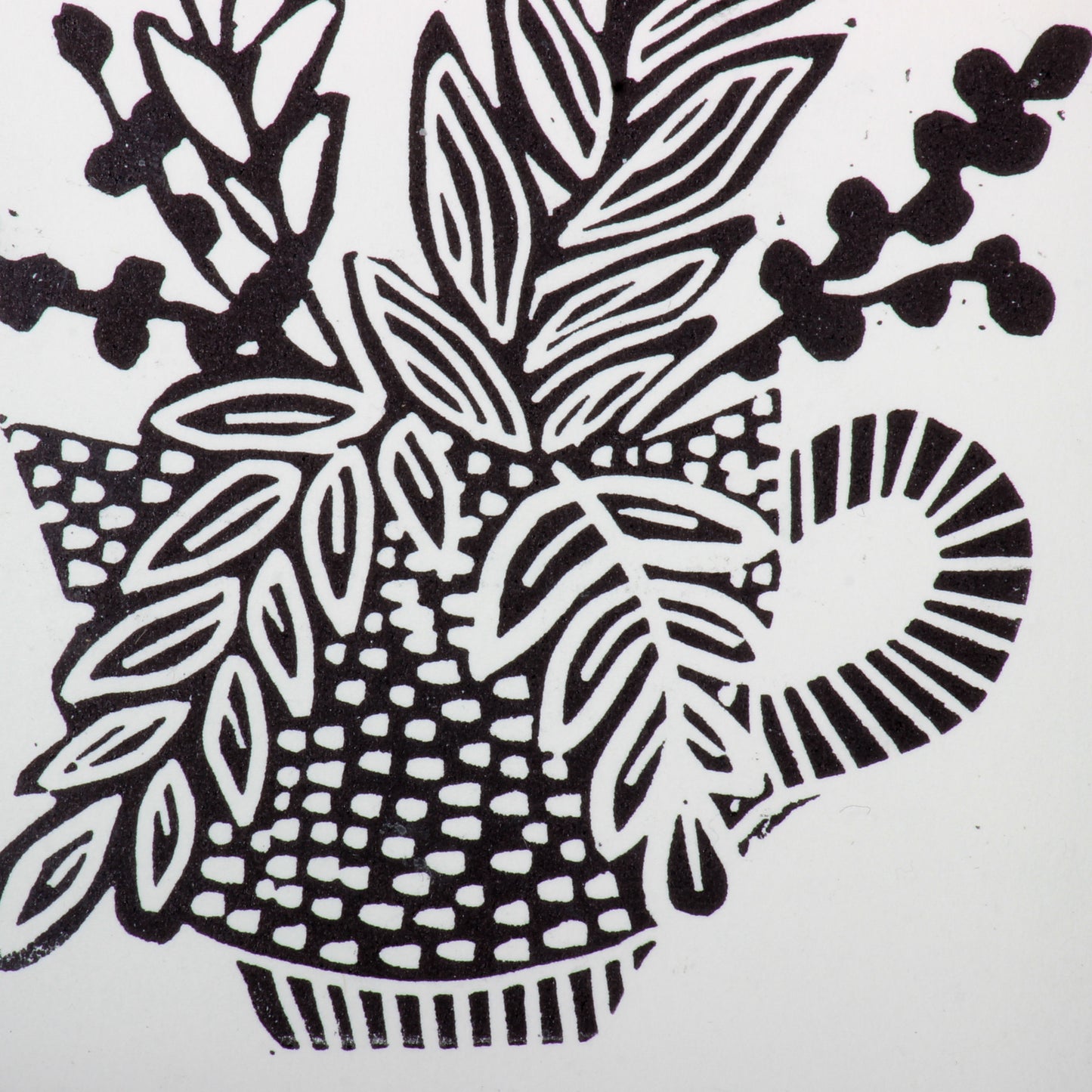 linocut of flowers in a tea cup