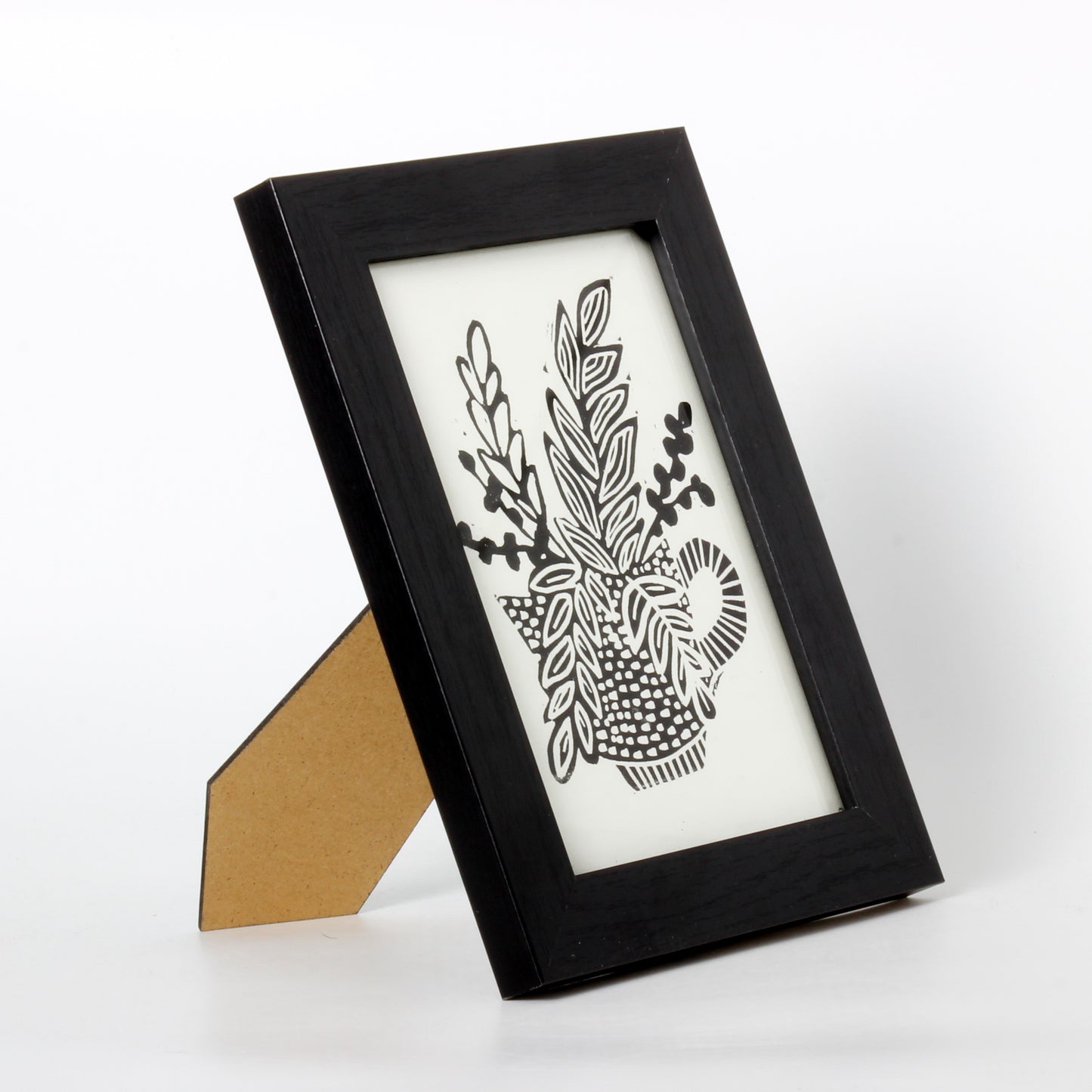 linocut of flowers in a teacup
