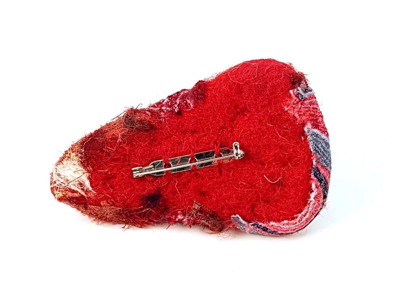 Back of red brooch