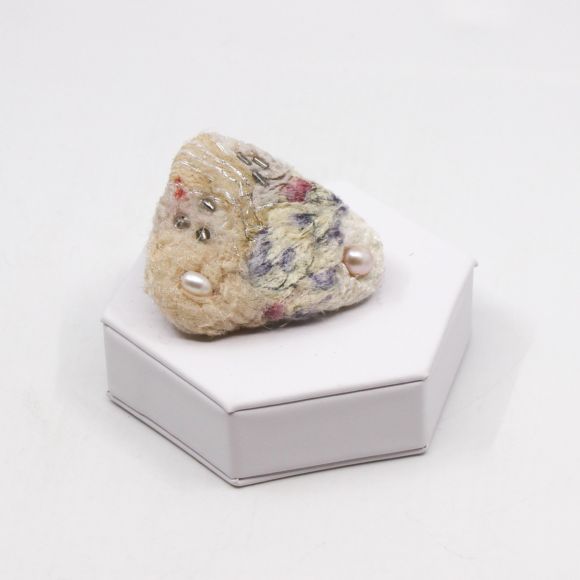 White felted triangle brooch with beads