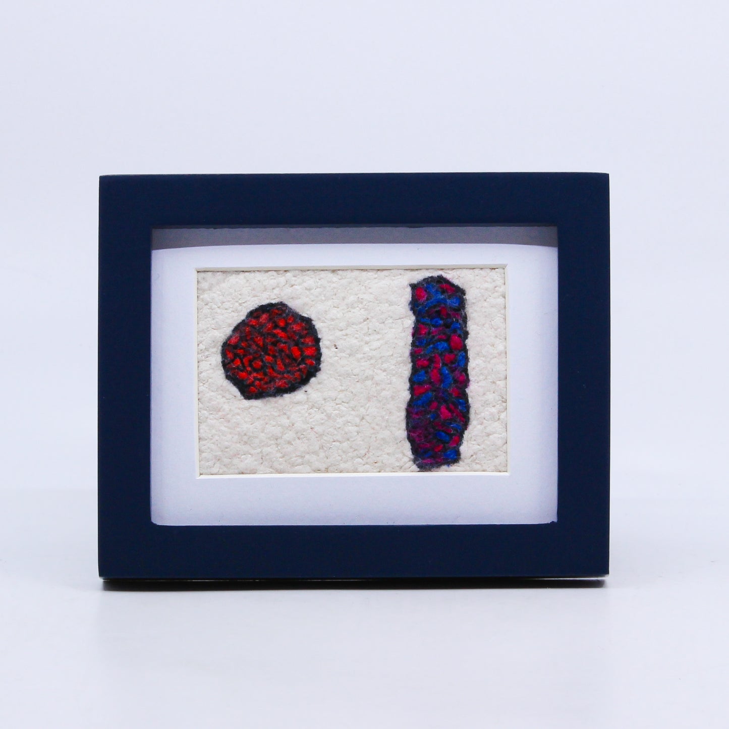 Abstract felted art in frame