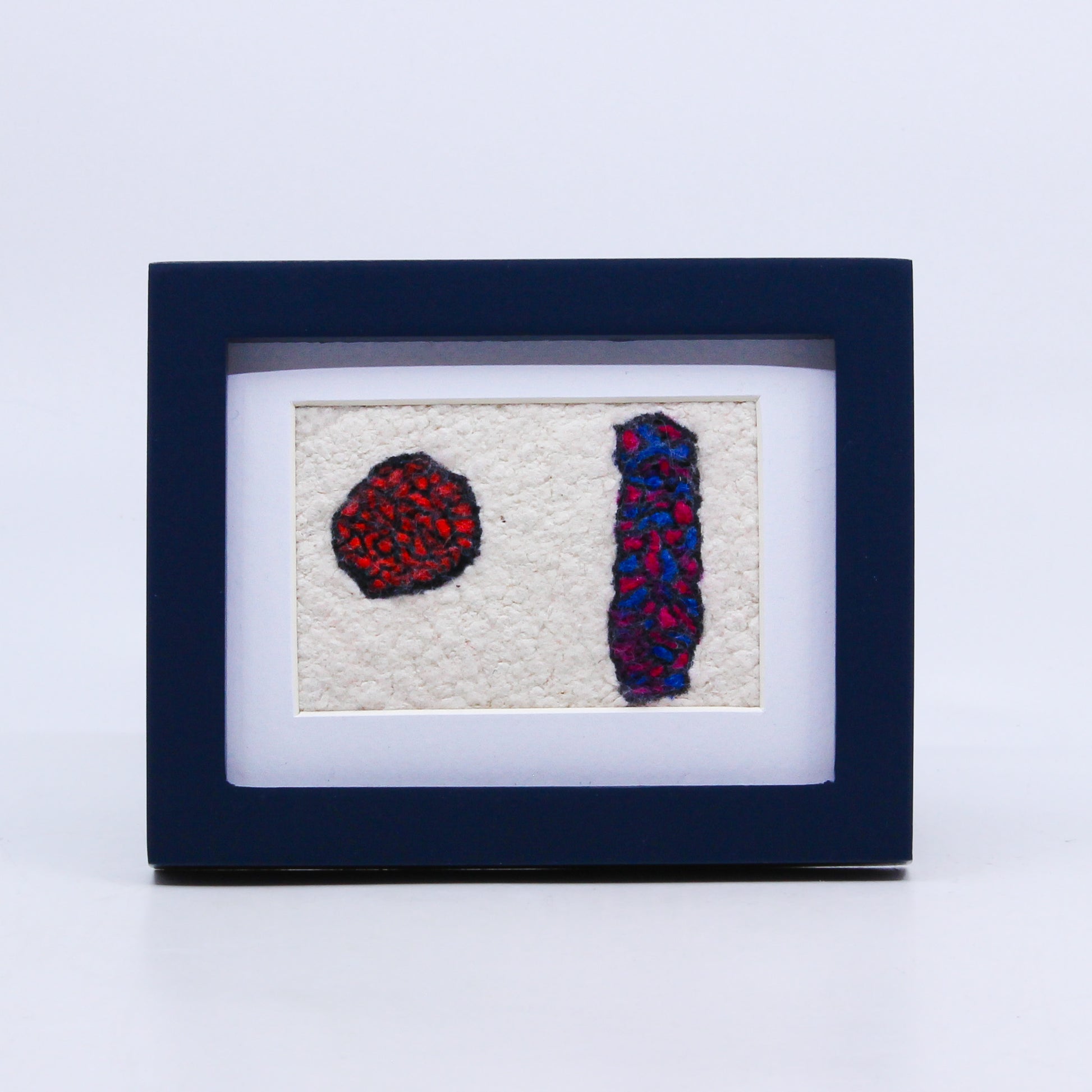 Abstract felted art in frame