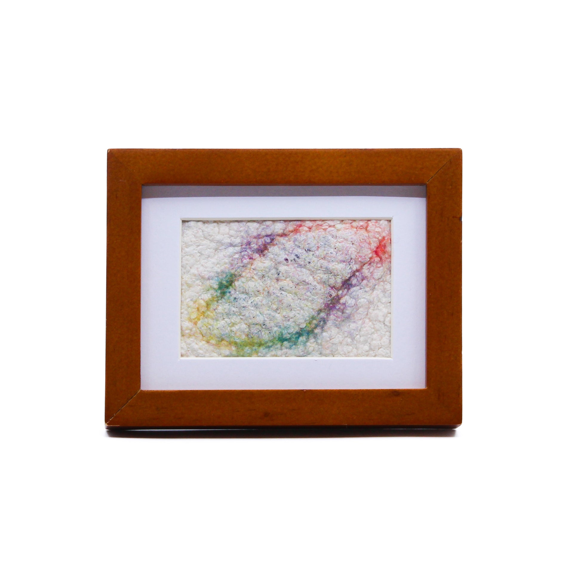 Abstract felted art in frame