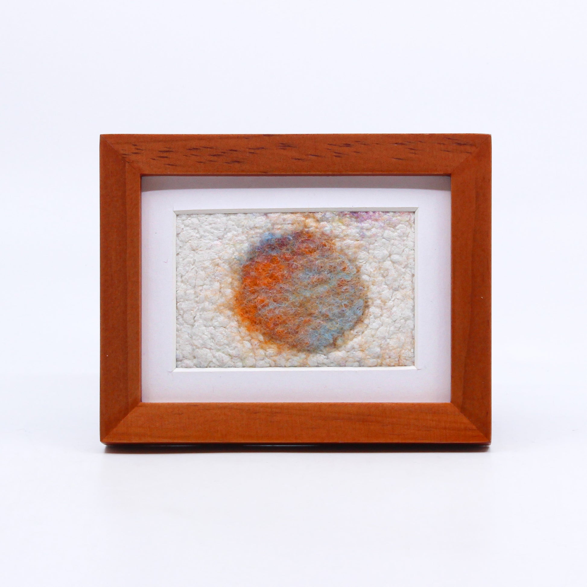 Abstract felted art in frame