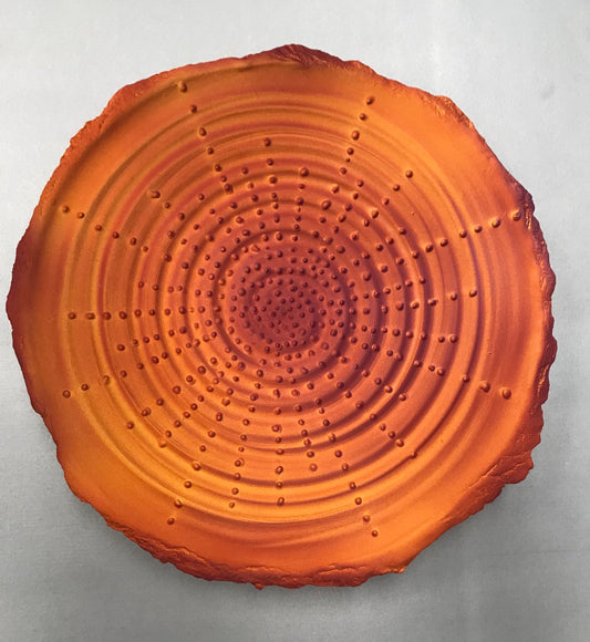 Orange clay circular plate