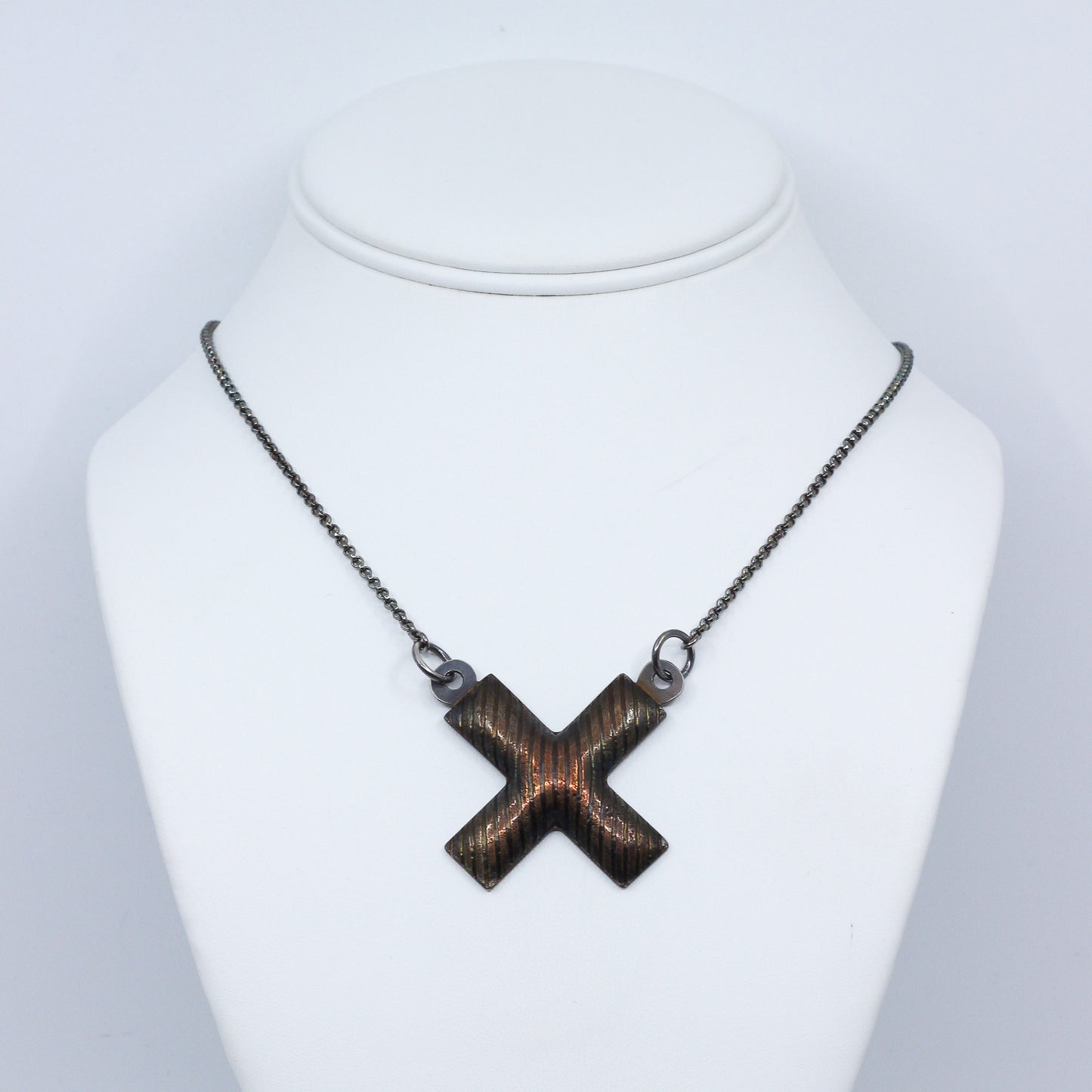 X-shaped pendant