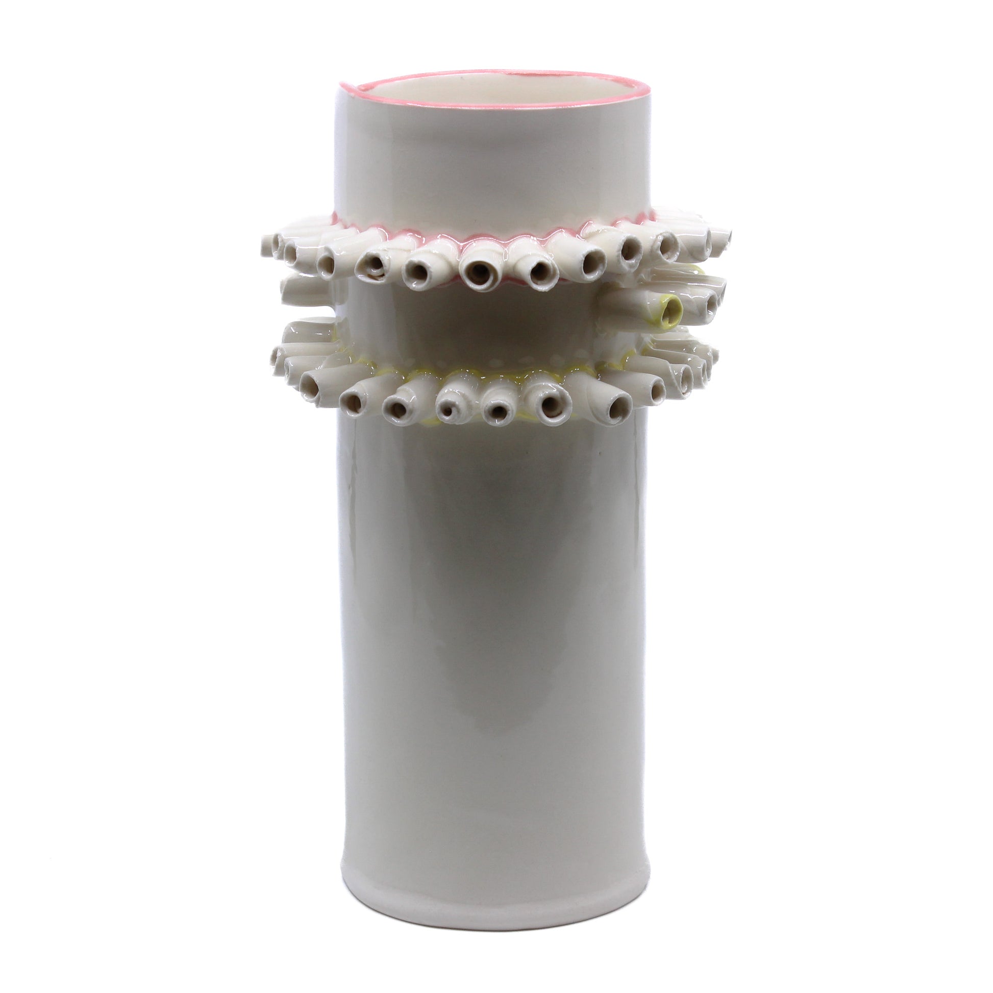 White vase with curled rolls of clay