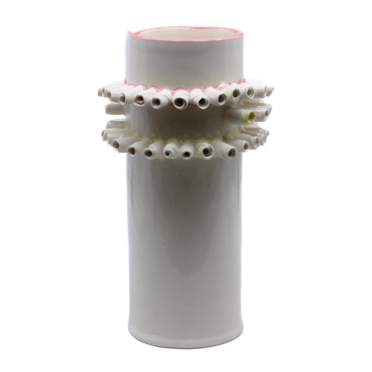 White vase with curled rolls of clay