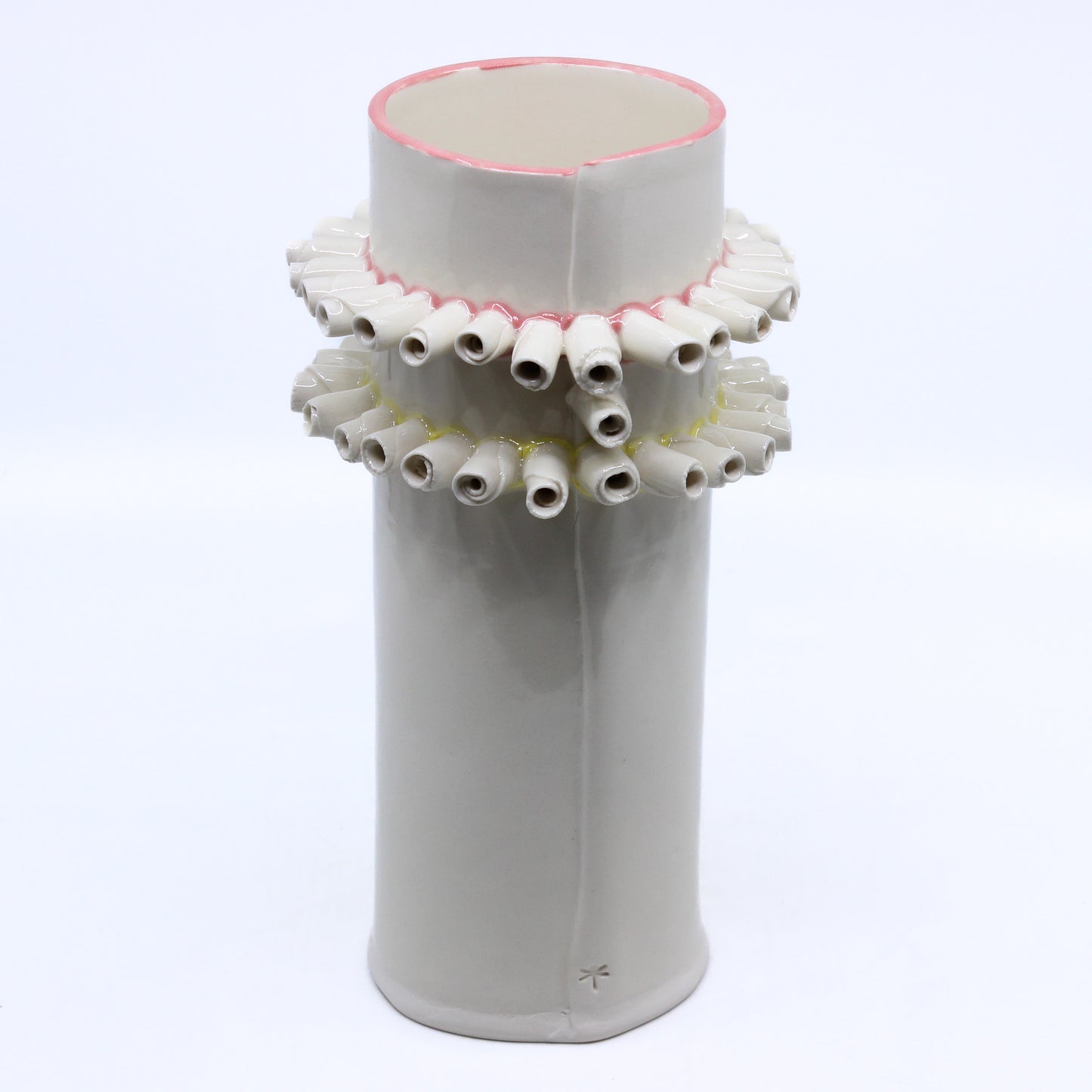 white vase with curls of clay accents