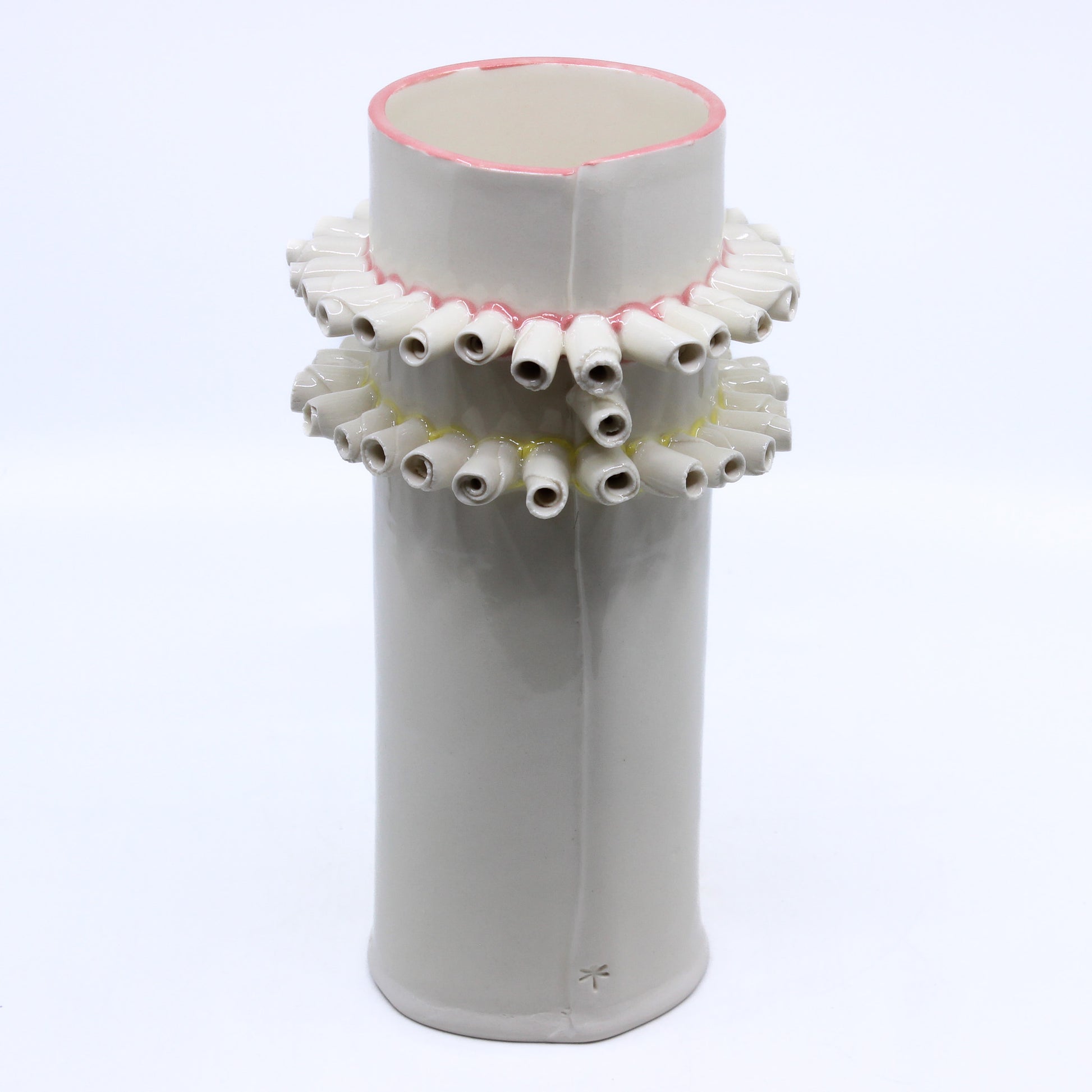 white vase with curls of clay accents