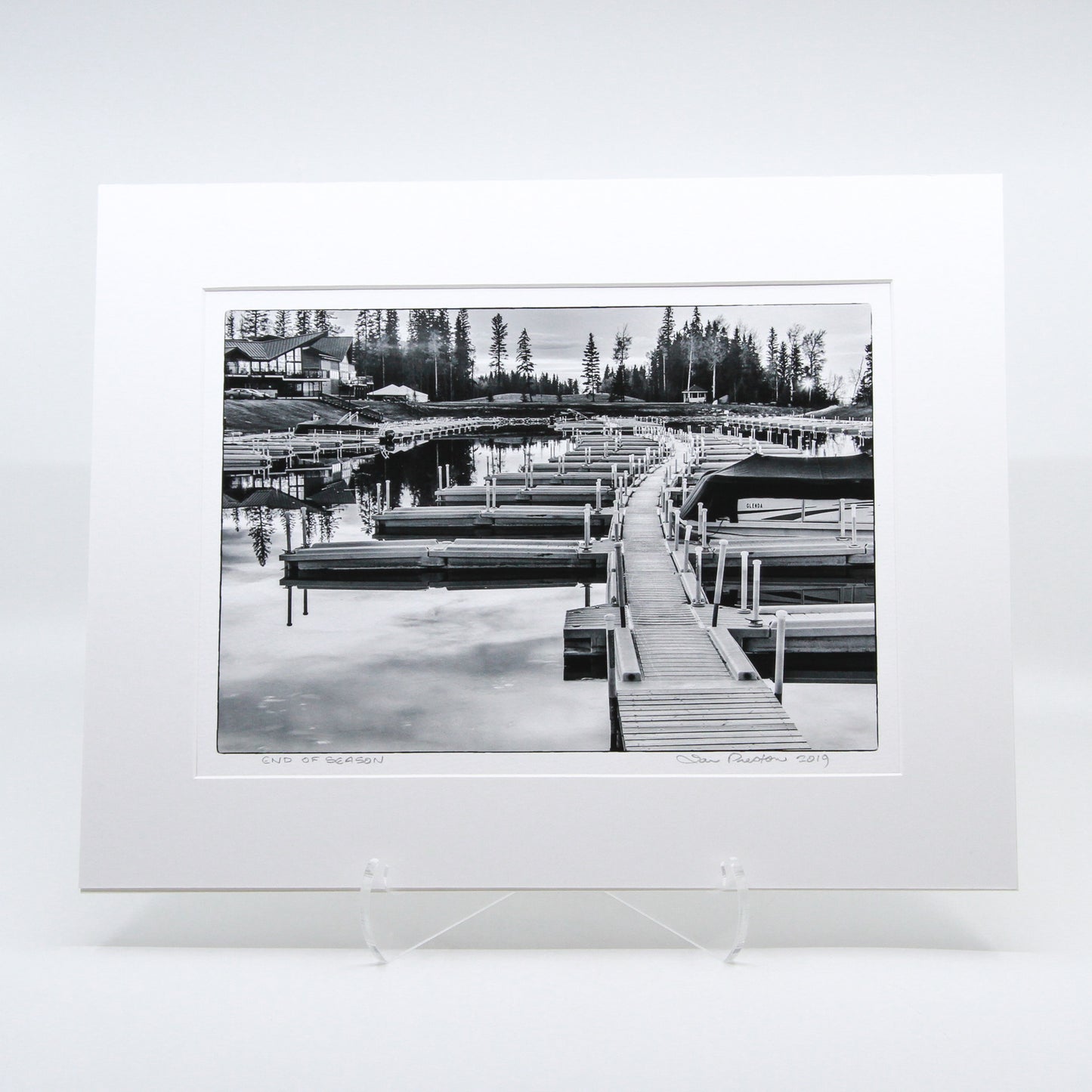 Black and white photo of a boat dock