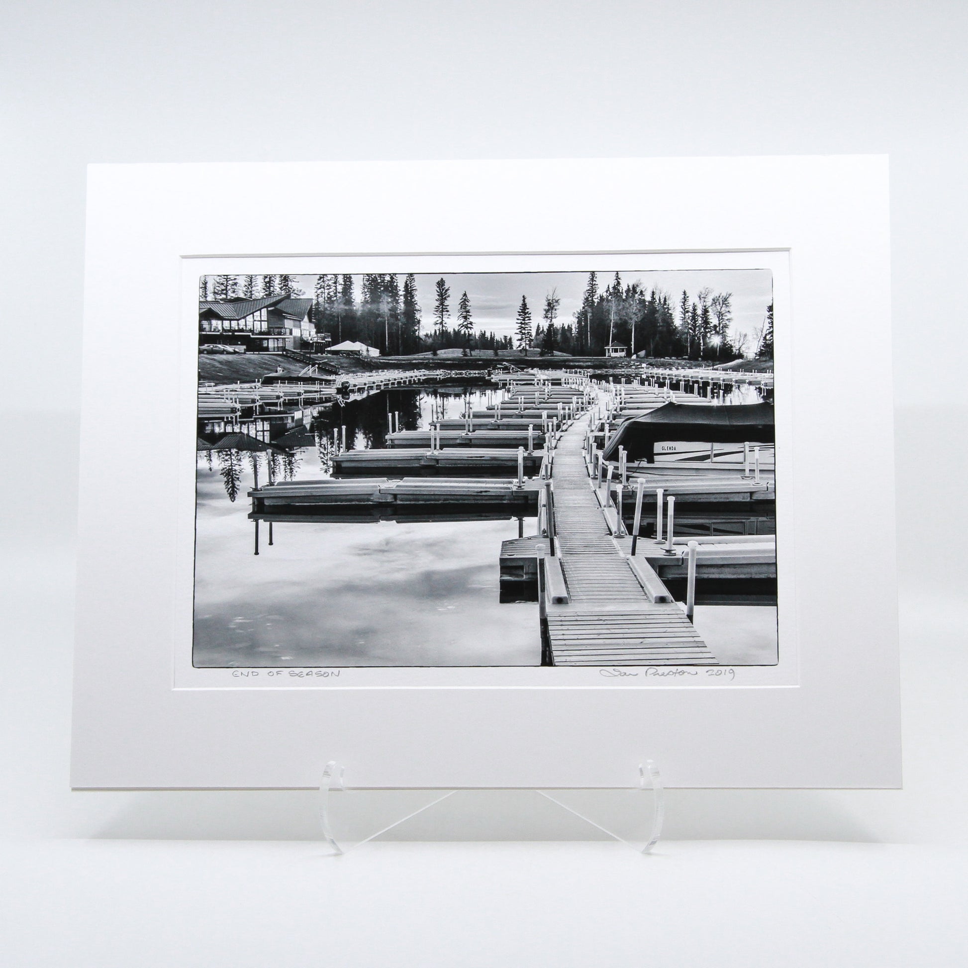 Black and white photo of a boat dock