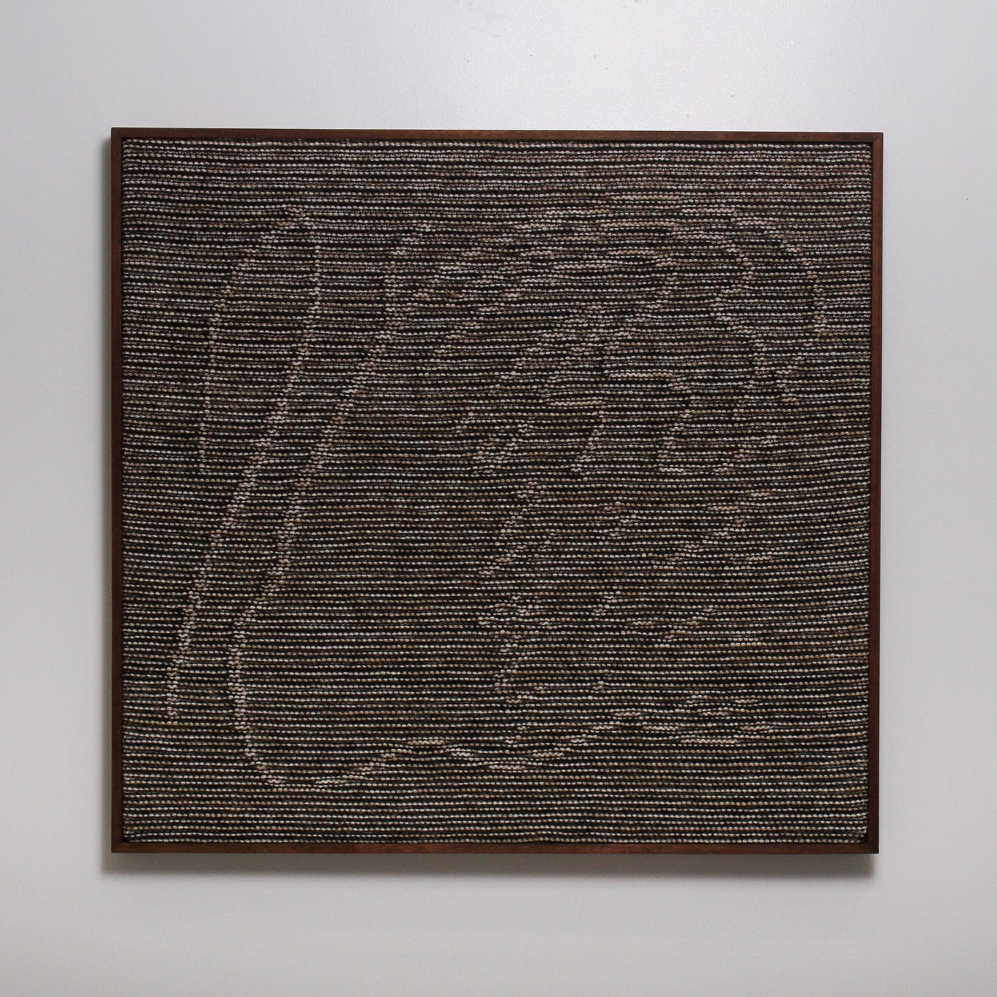 Knitted Wall Hanging in brown, cream, and dark brown yarn with metallic thread