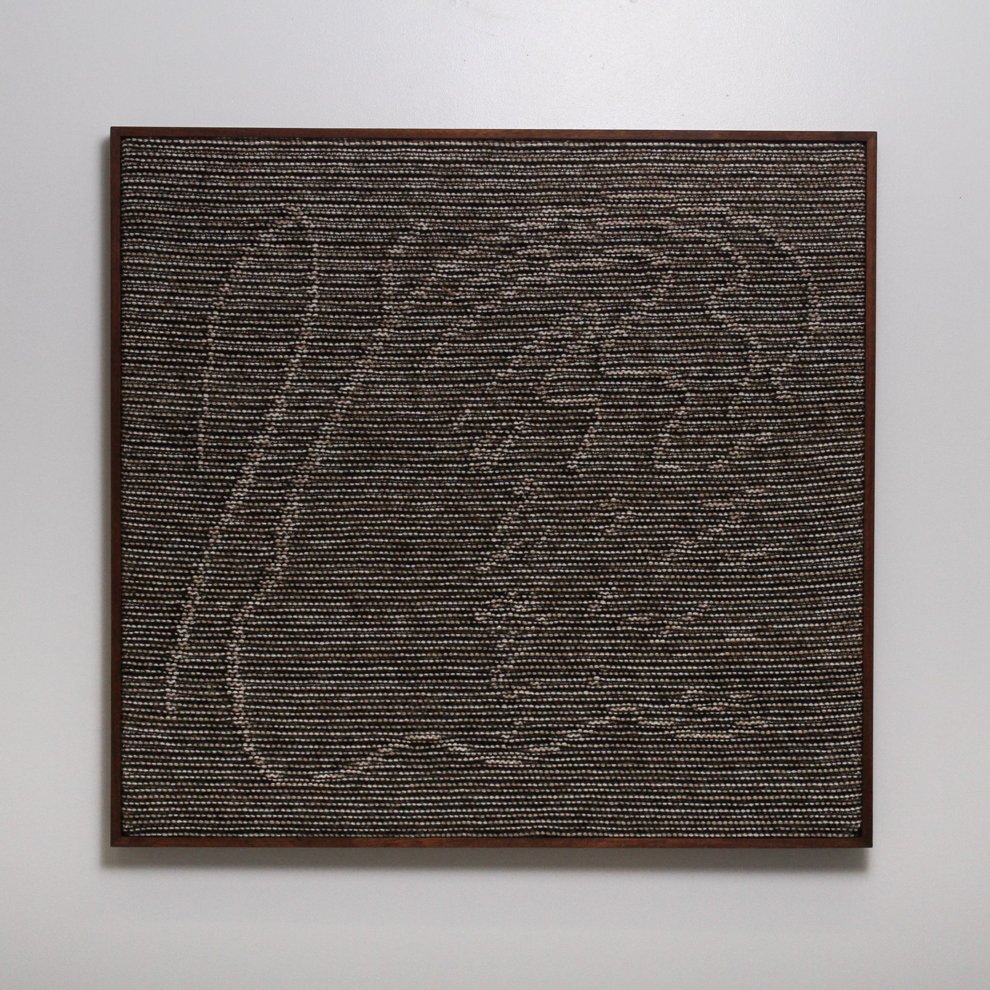 Knitted Wall Hanging in brown, cream, and dark brown yarn with metallic thread