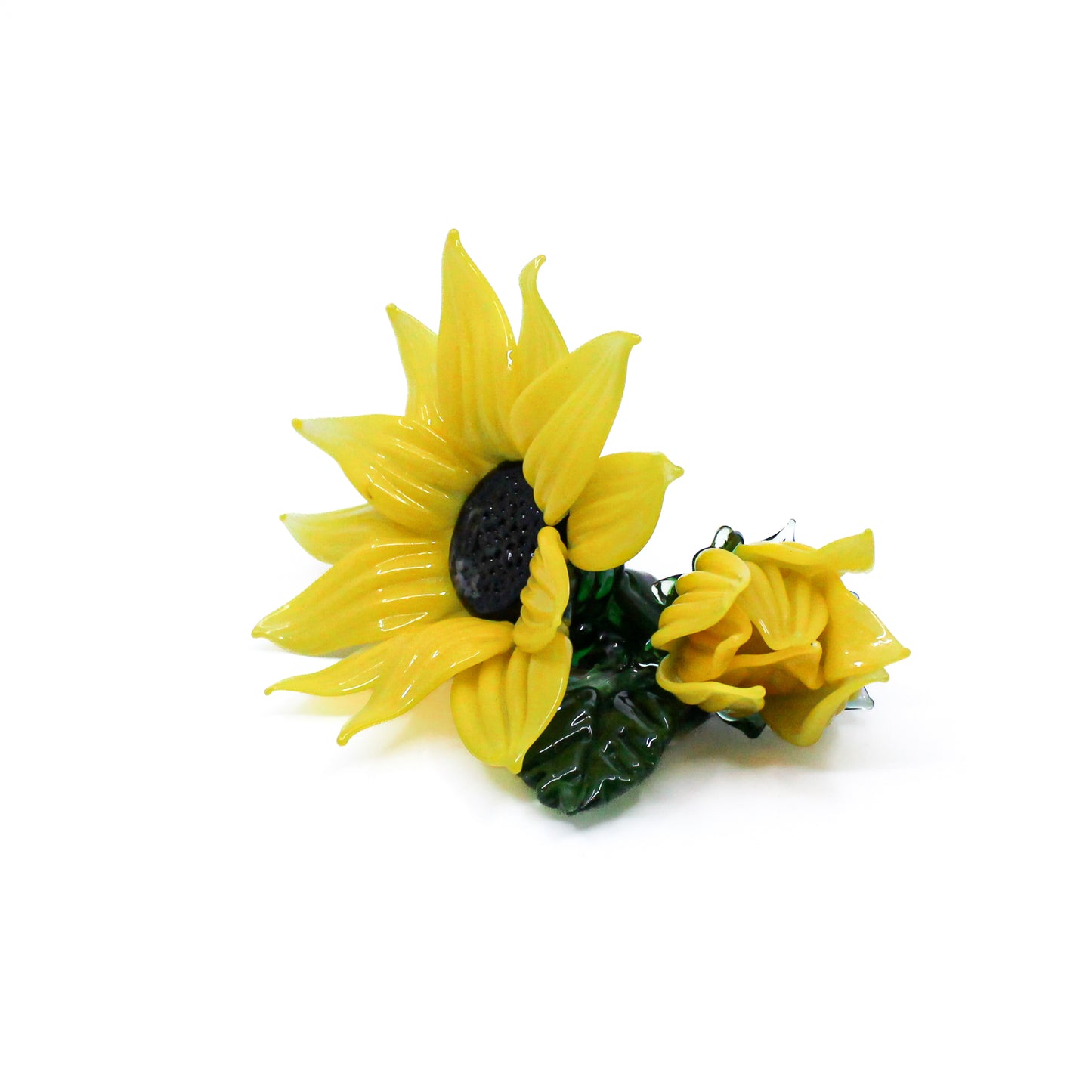 Sunflower with bud and leaf. Sits on a desk.