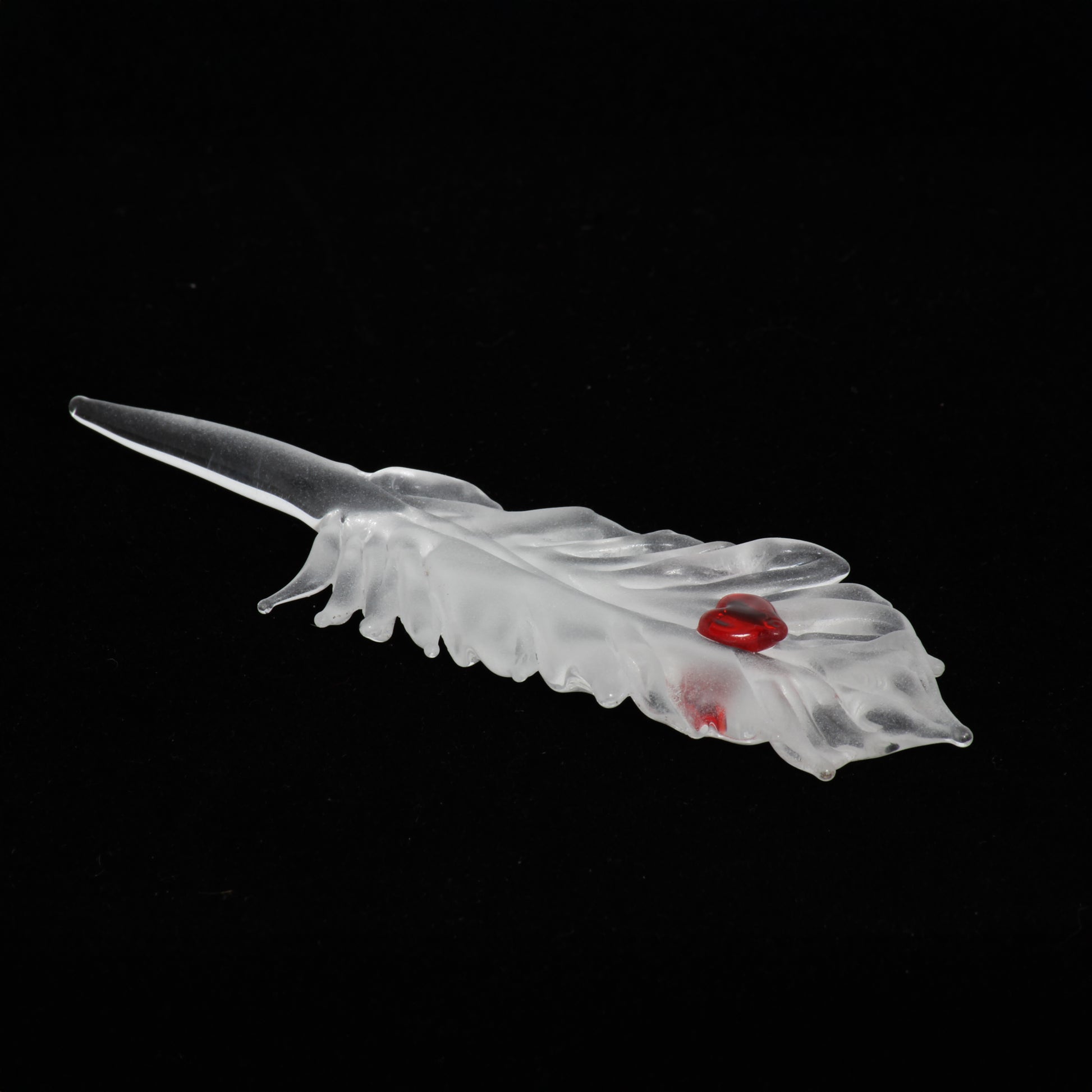 translucent feather with red heart ornament