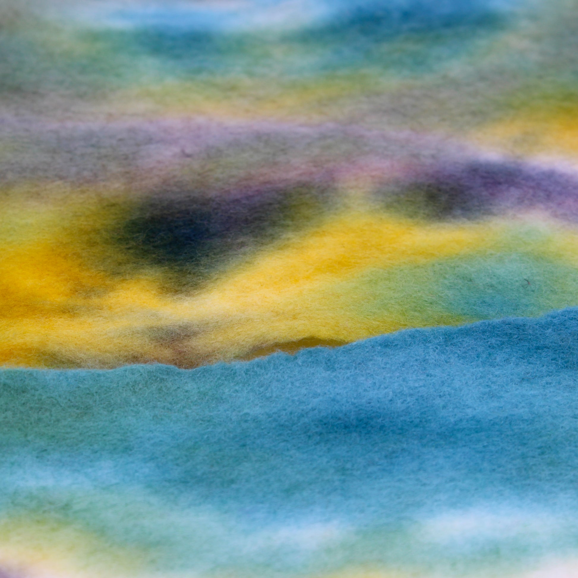 Green, blue, yellow, and white felted scarf