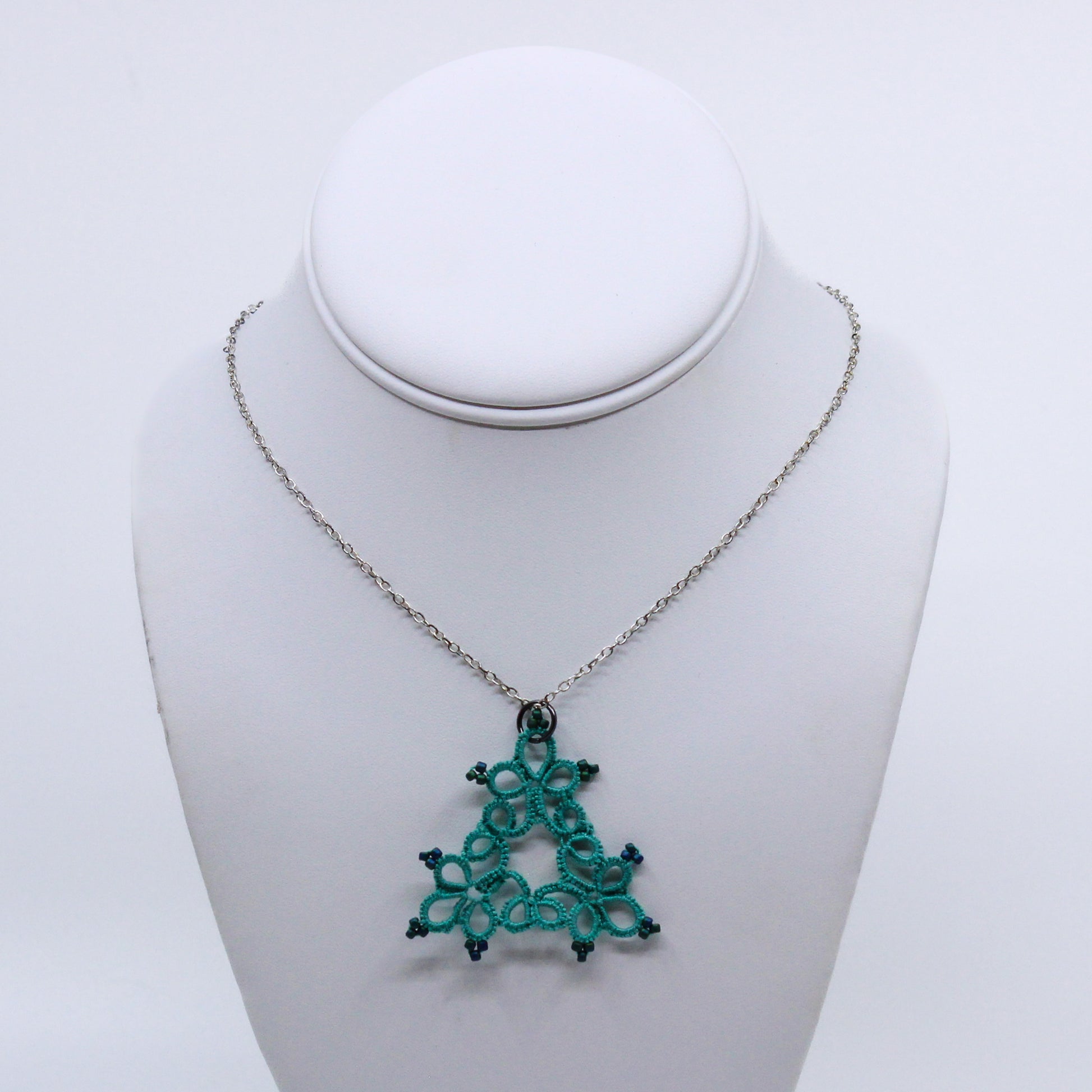 teal triangle shaped doily necklace with beads