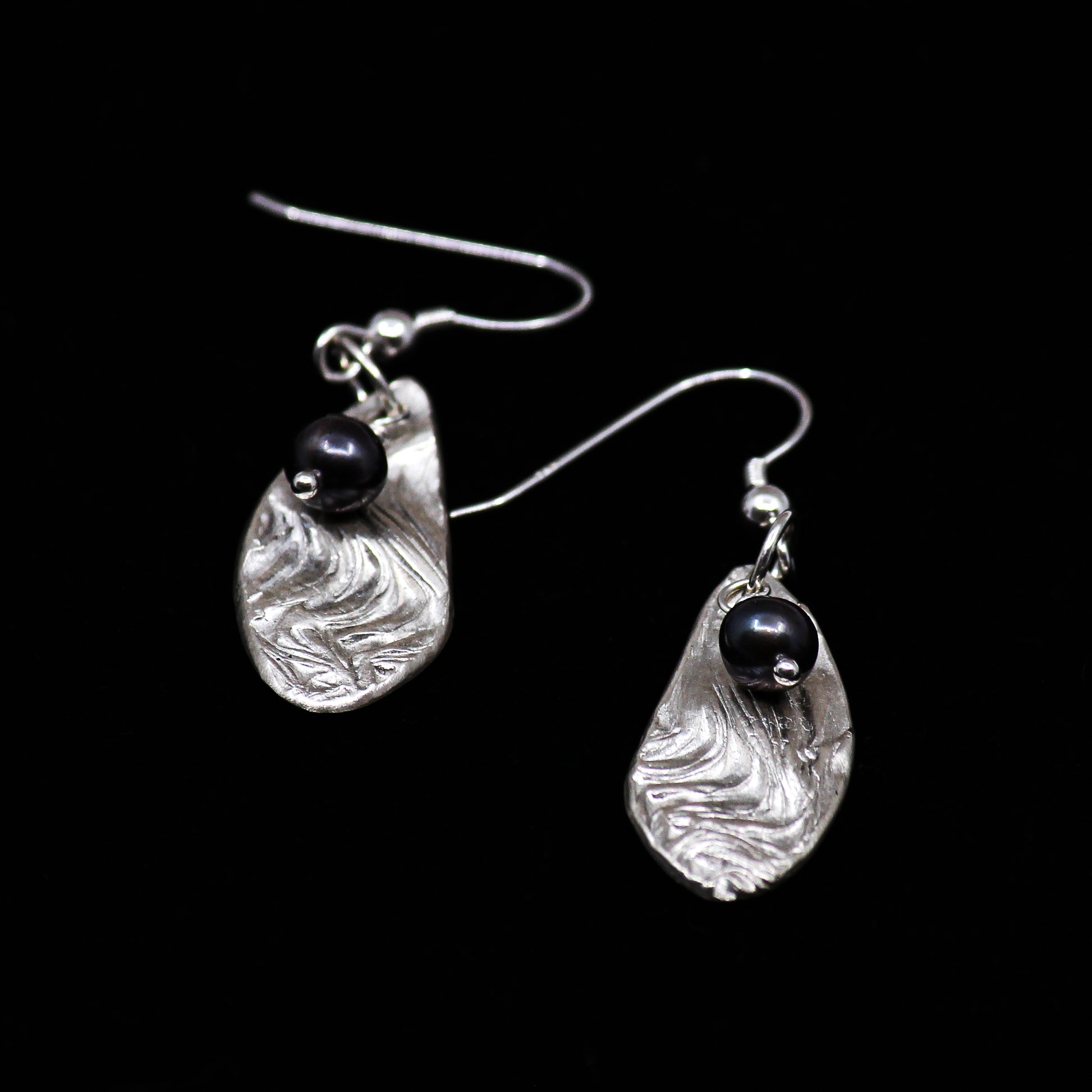 silver earrings with black pearl