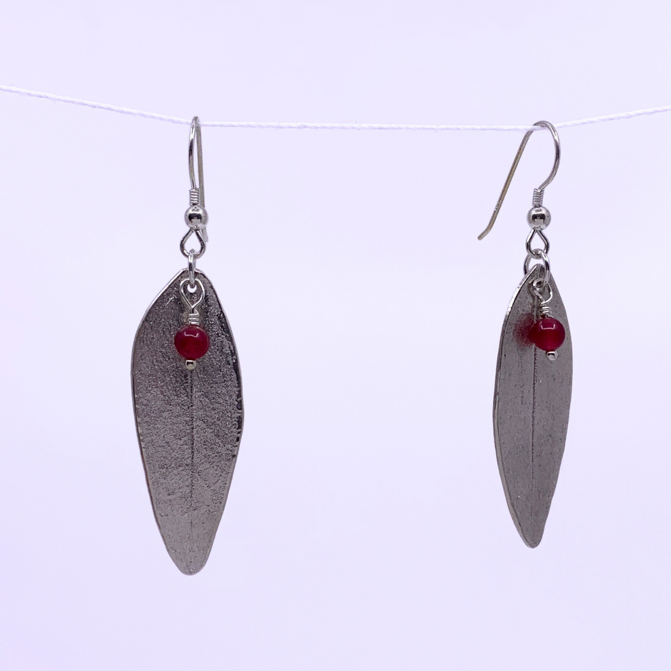 silver leaf earrings with red jade bead