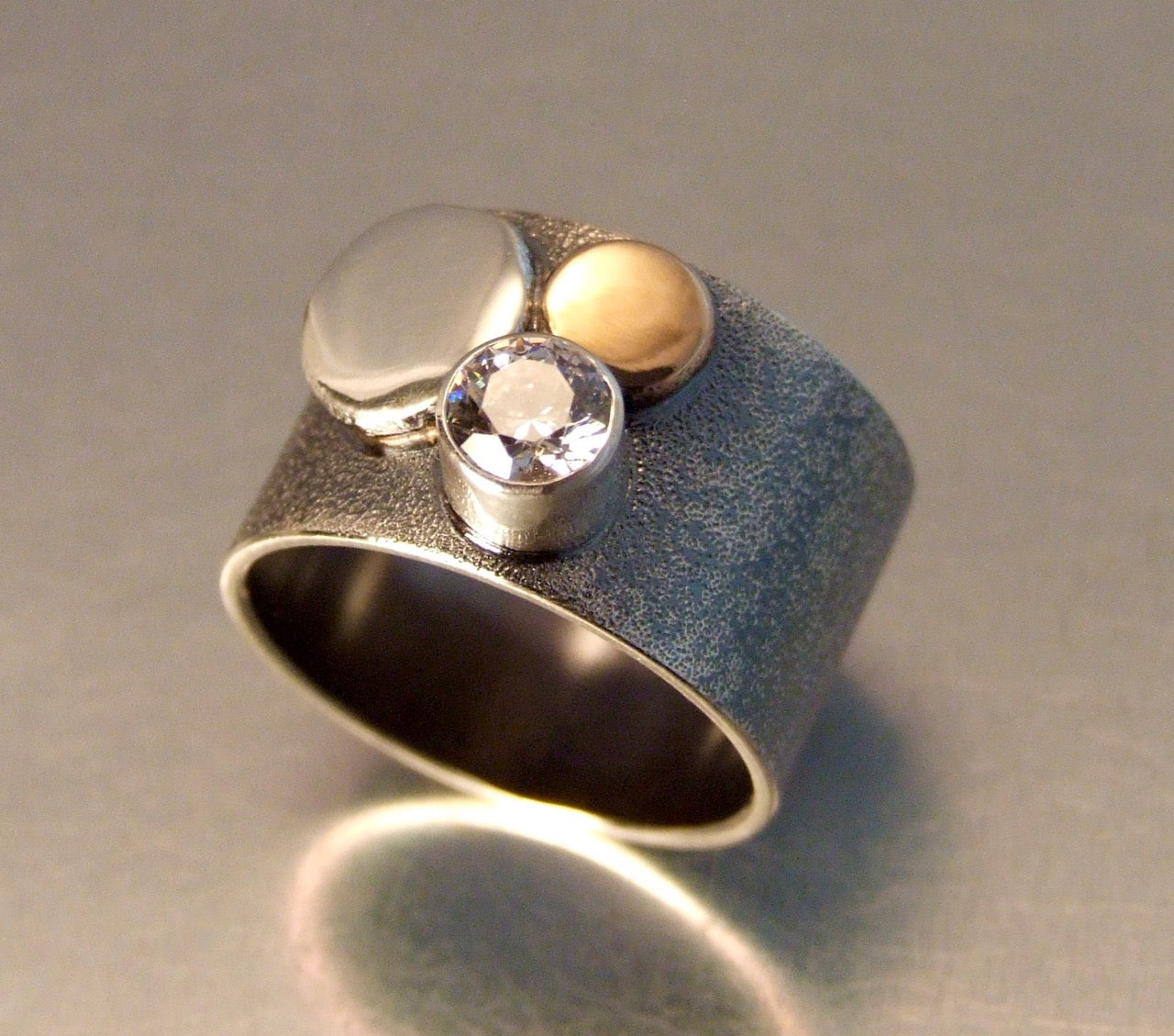 Silver band with silver, gold, crystal studs
