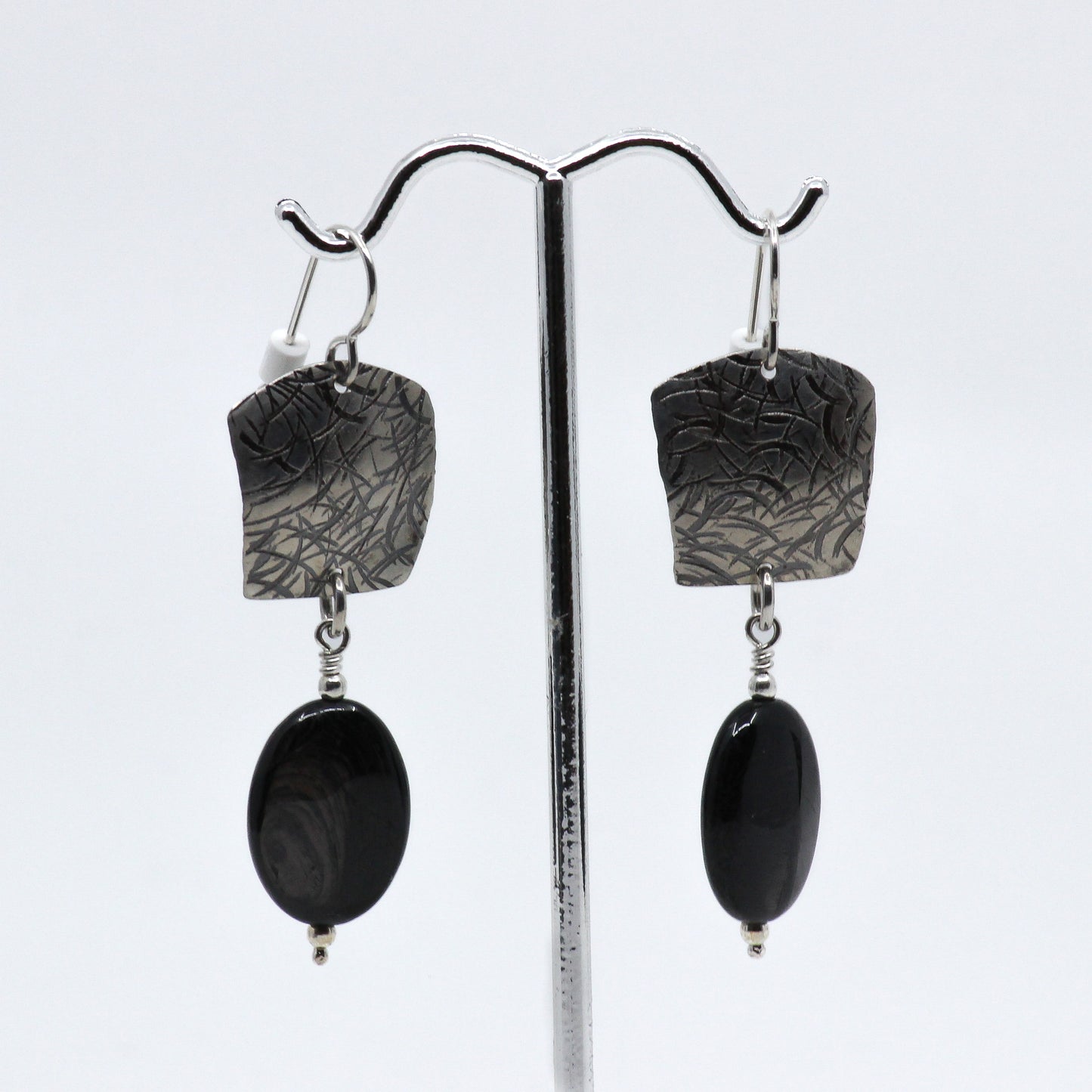 Dangle earrings with sterling silver and black stone