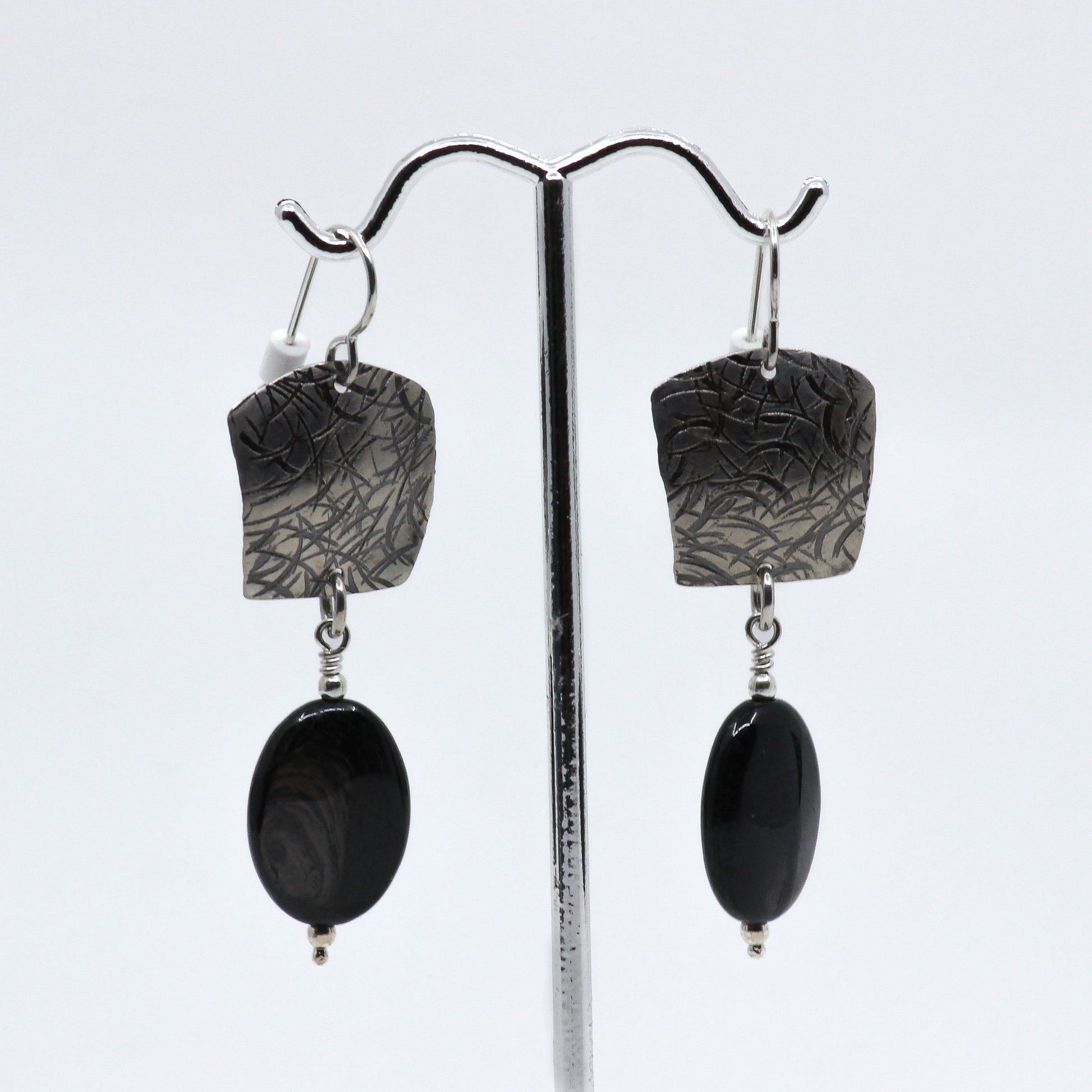 Dangle earrings with sterling silver and black stone