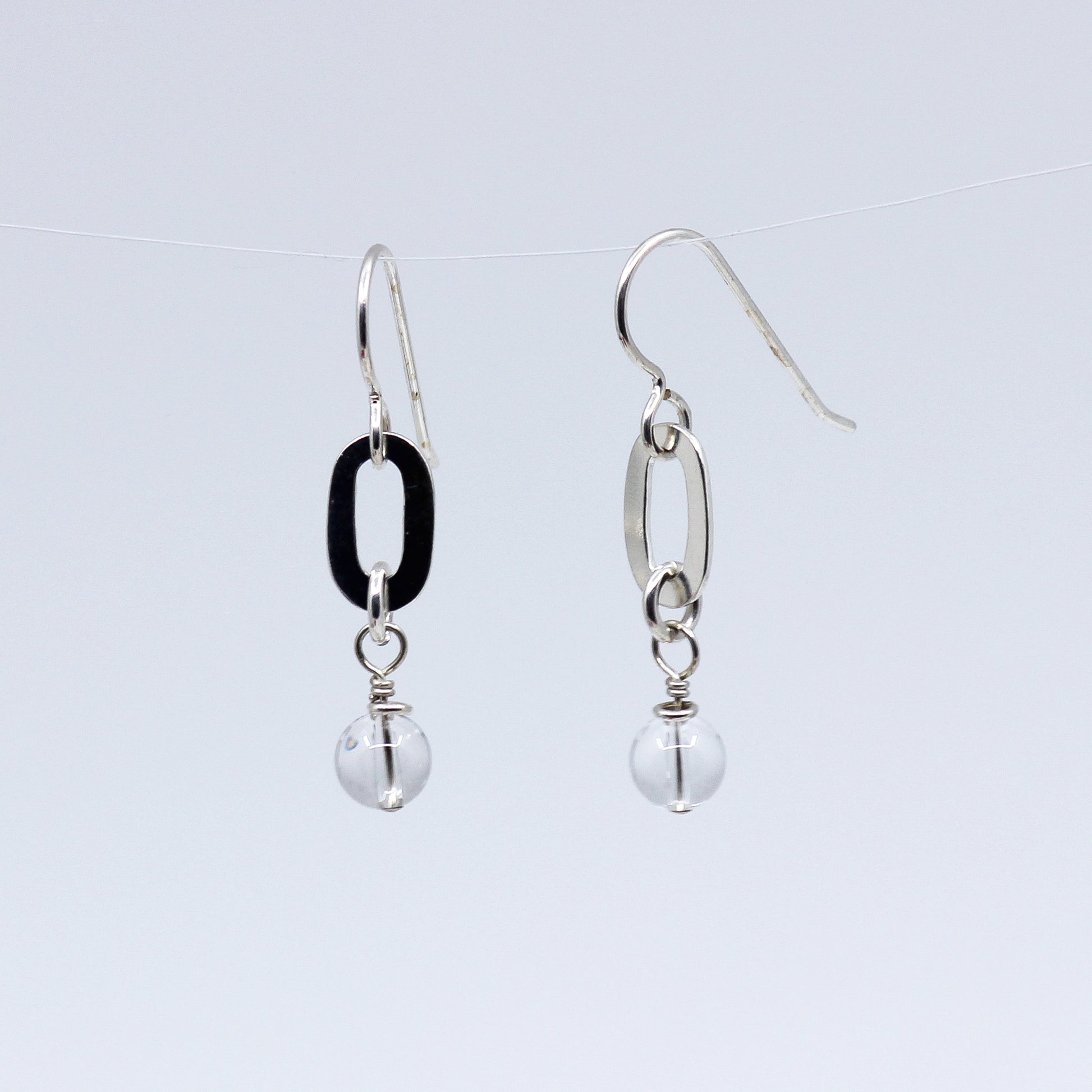 Oval link earring with clear quartz