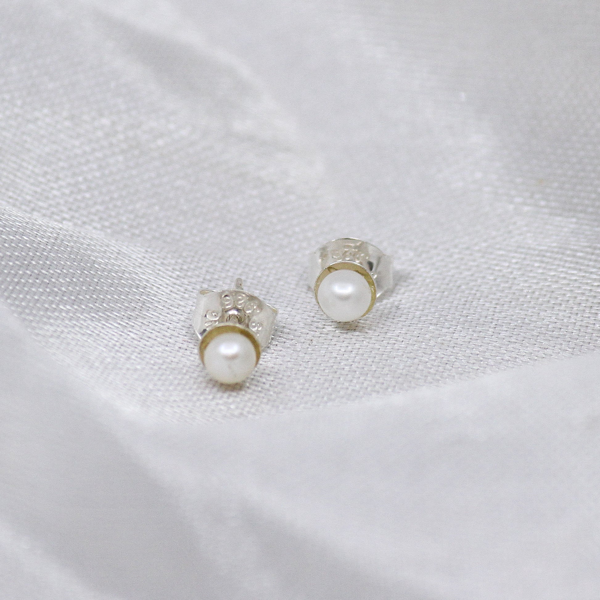 White pearl earrings