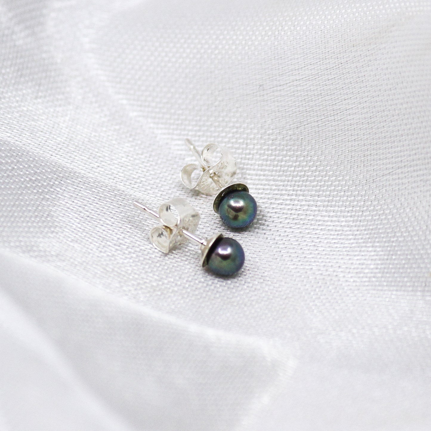 Raven wing pearl earrings