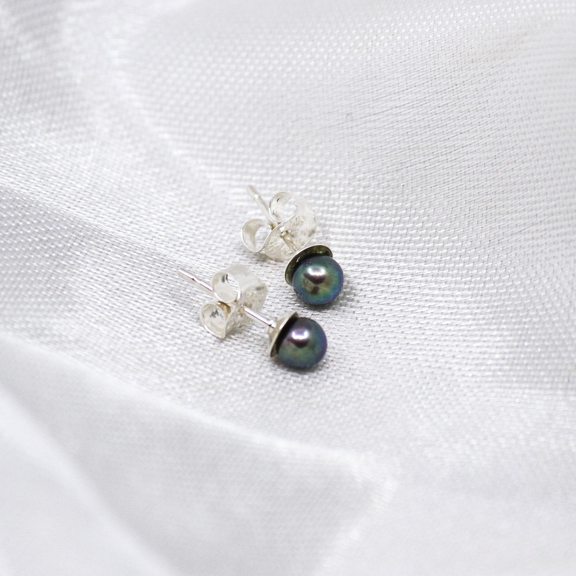 Raven wing pearl earrings