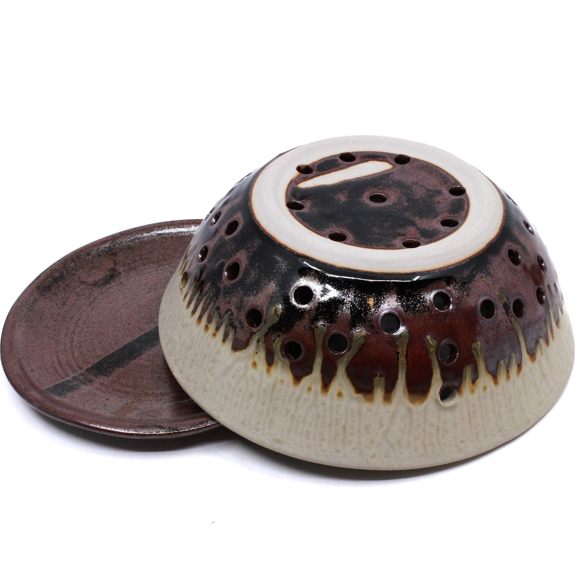 Brown and cream berry bowl strainer with saucer